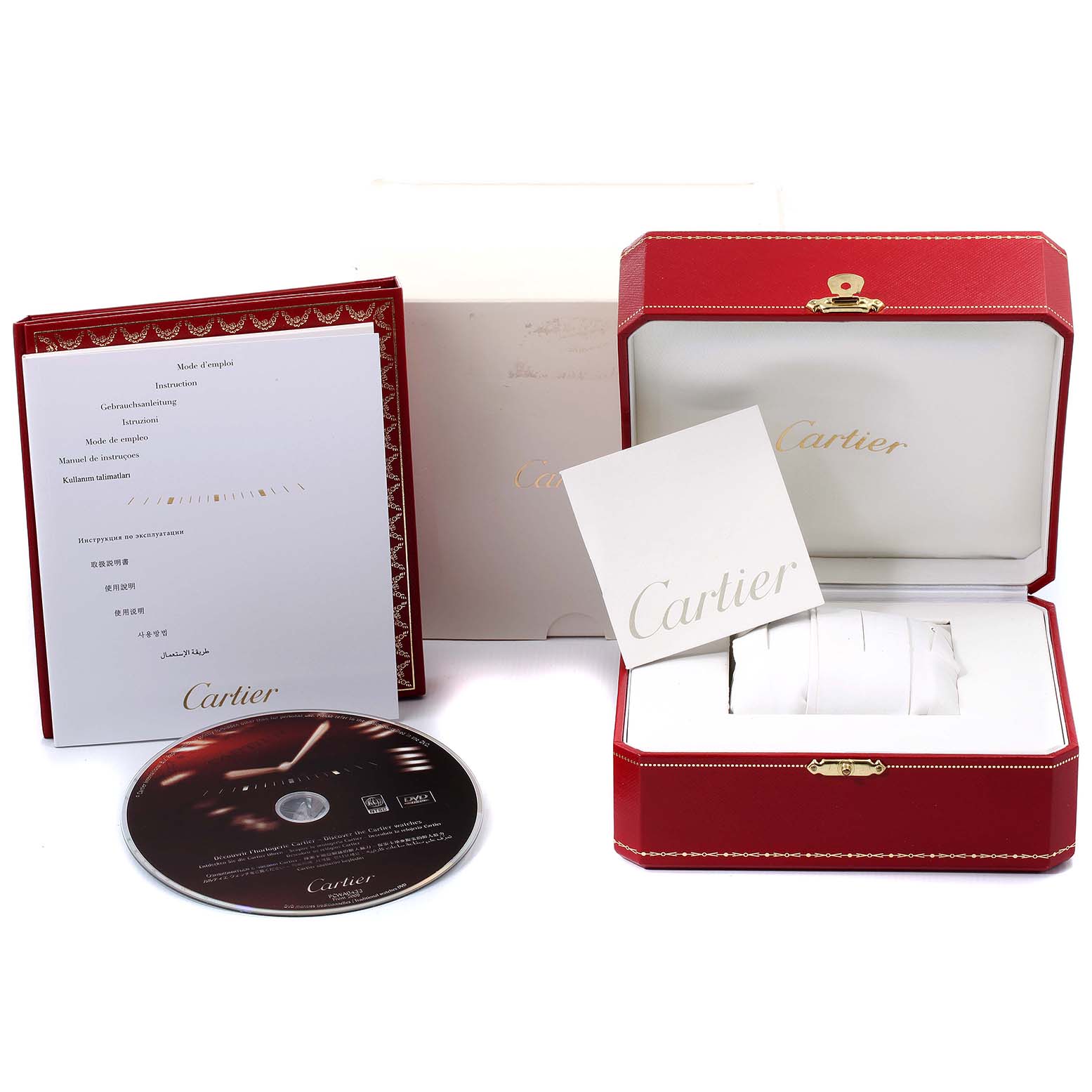 The image shows the packaging and accessories for the Cartier Tank MC W5330003 Men
s Stainless Steel Silver Dial W5330003 Men
s Stainless Steel Silver Dial watch, including a red box, manuals, and a DVD.