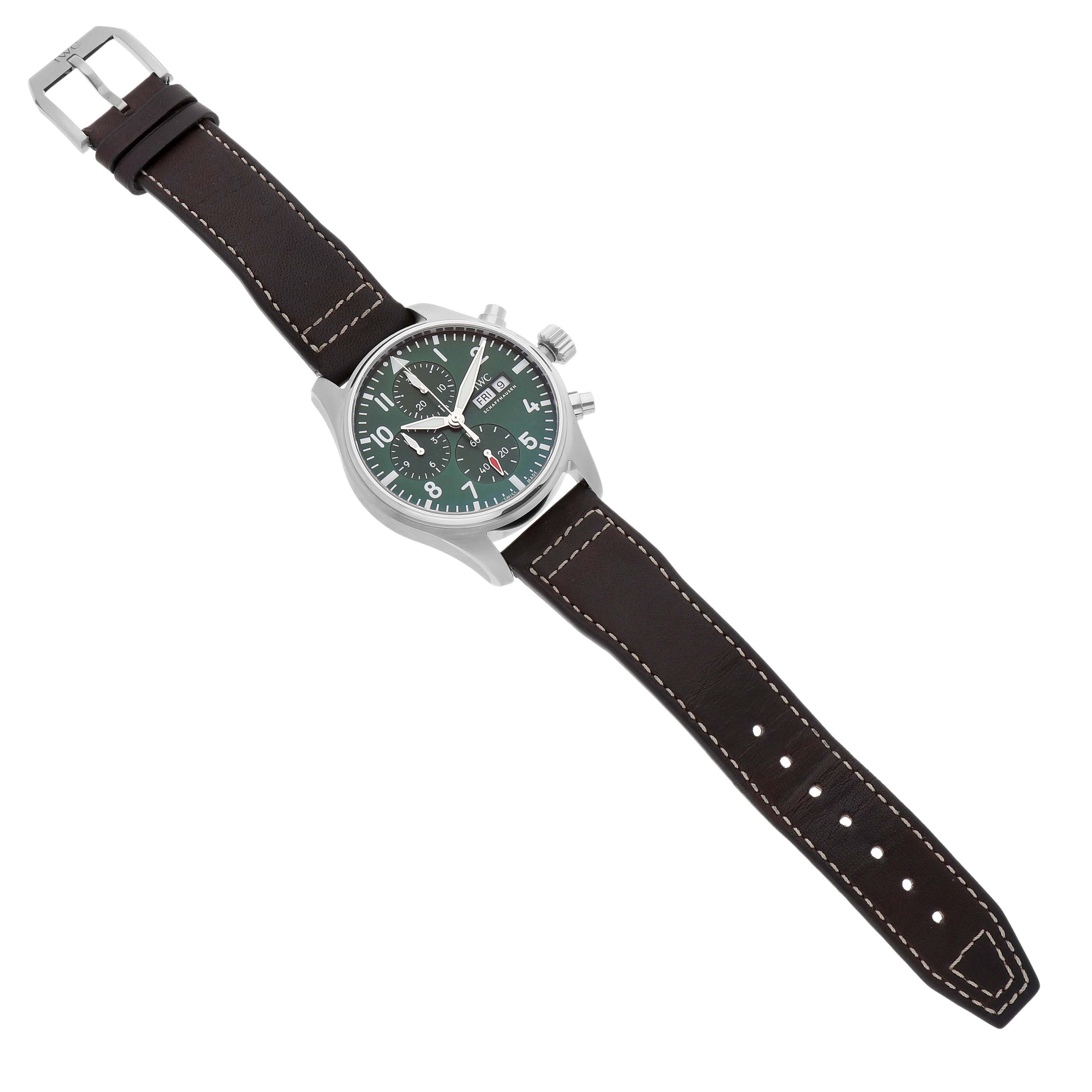 The IWC Pilot IW388103 Men's Stainless Steel Green Dial model watch is shown from a top-down angle, highlighting the face, case, strap, and buckle.