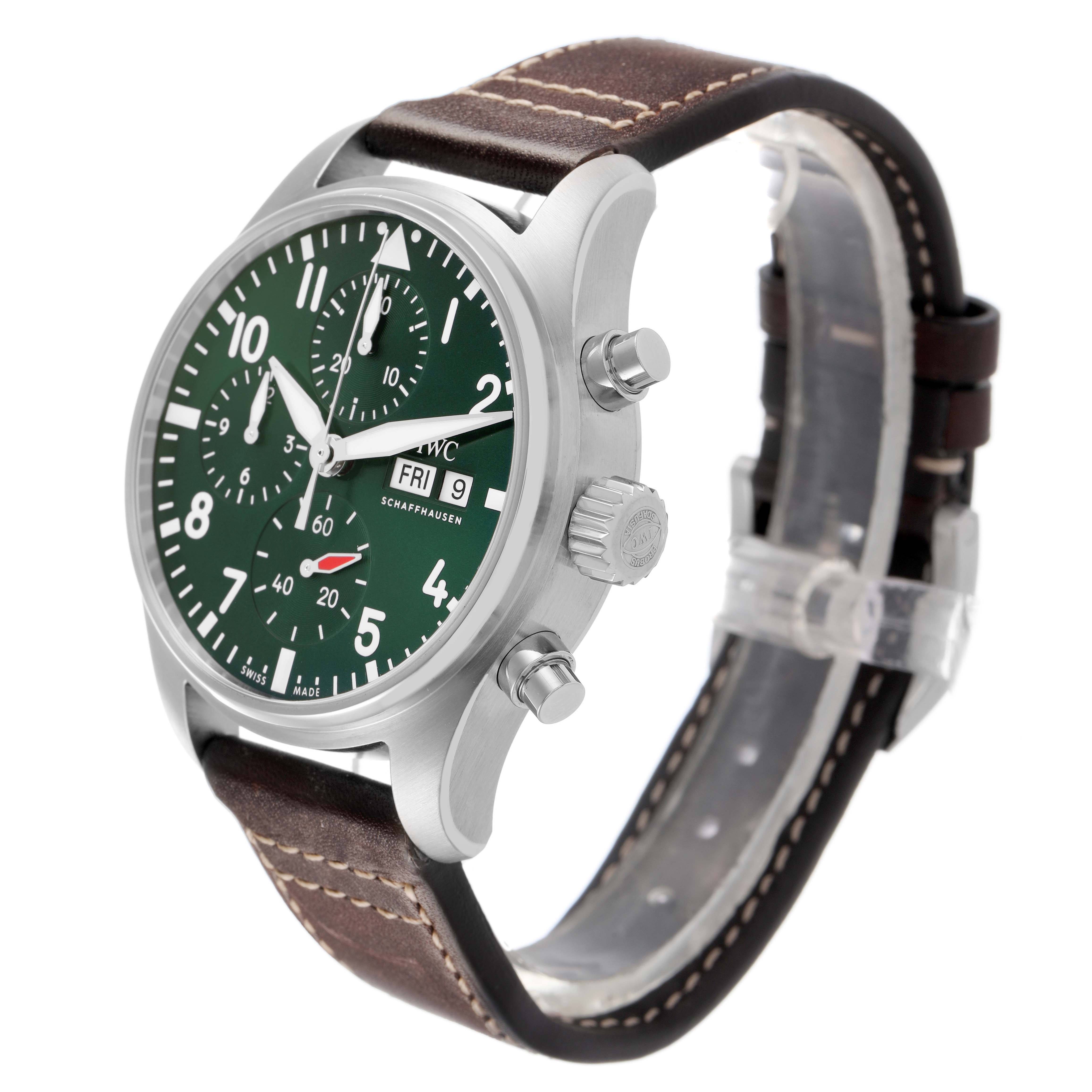 The IWC Pilot IW388103 Men's Stainless Steel Green Dial watch is shown from a front-side angle, displaying its green dial, chronograph buttons, crown, and leather strap.