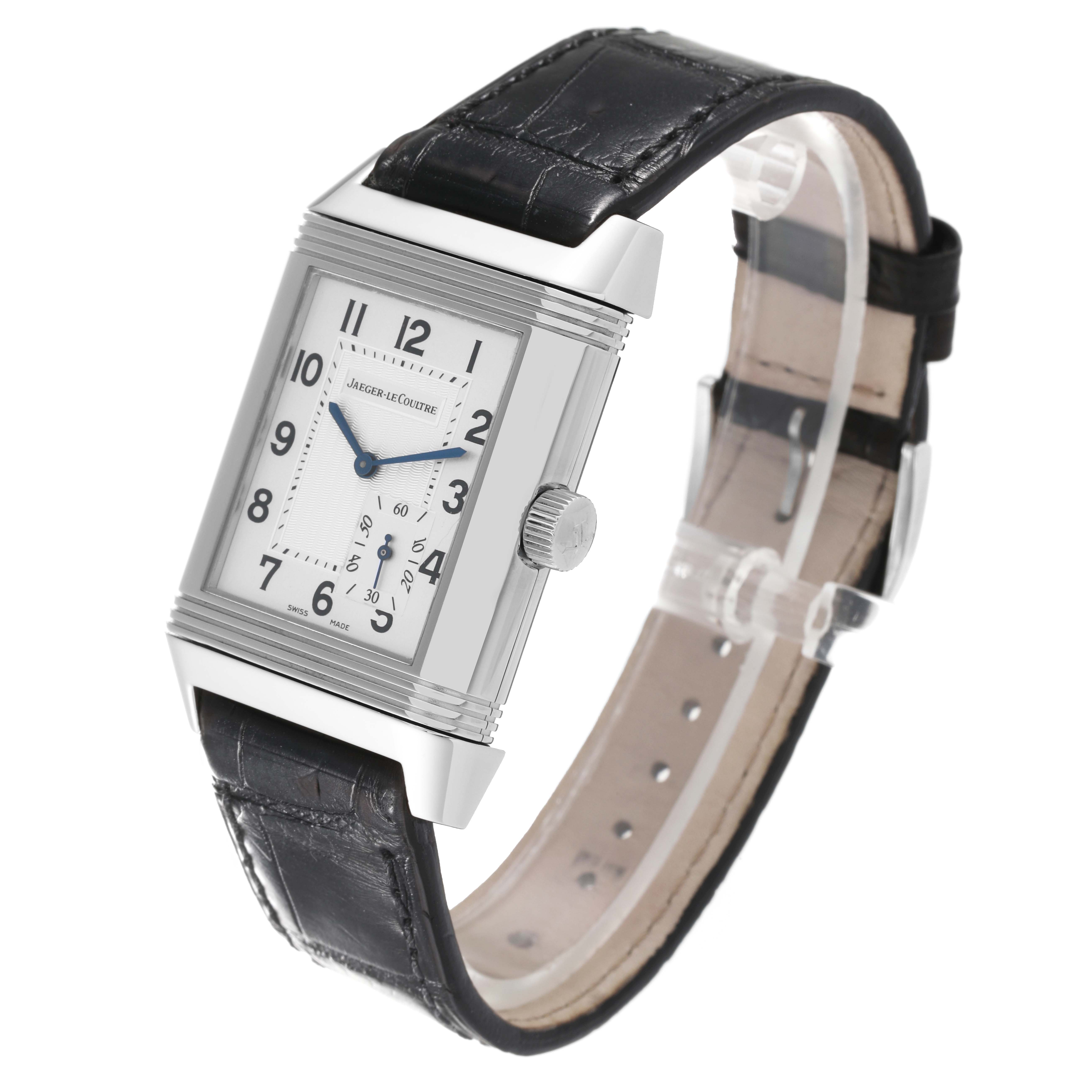 The image shows the Jaeger-LeCoultre Reverso model watch, angled to display the face, side profile, crown, and strap.