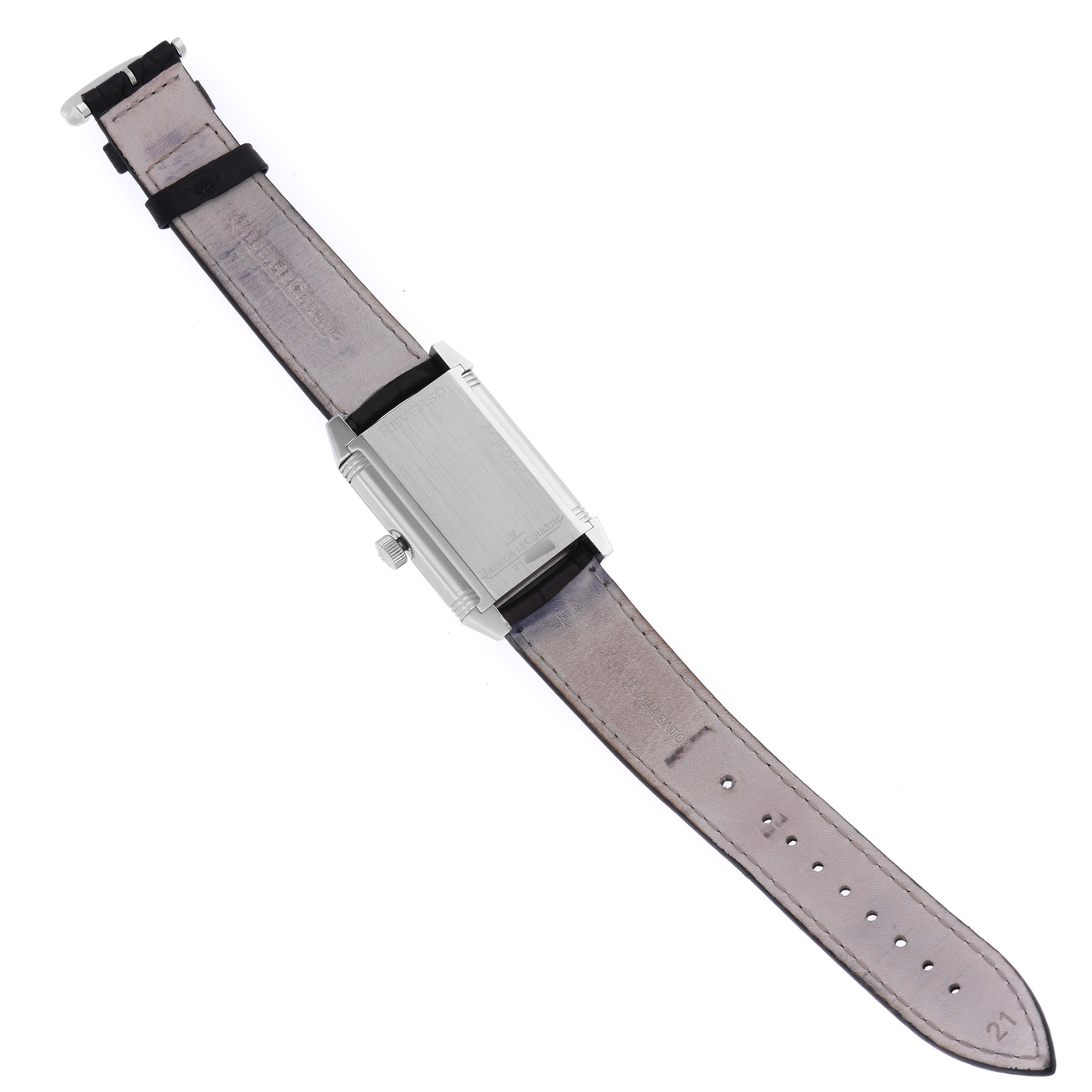 The Reverso model by Jaeger LeCoultre is shown from the back with a full view of the strap and case.