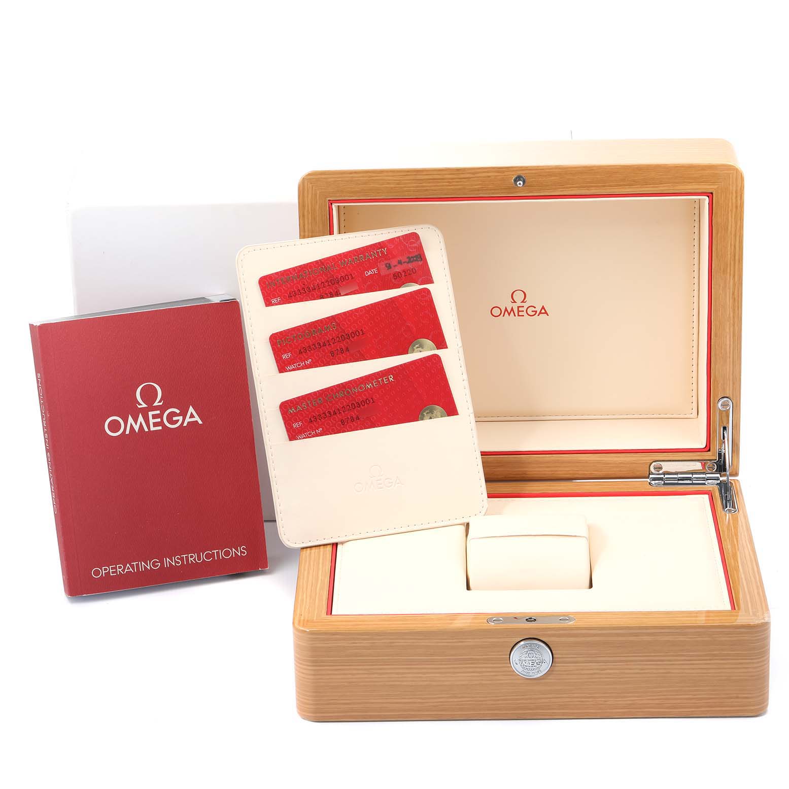 The image shows an Omega De Ville 433.33.41.22.03.001 Men's Stainless Steel Blue Dial 433.33.41.22.03.001 Men's Stainless Steel Blue Dial watch box, warranty cards, and operating instructions from a front angle.