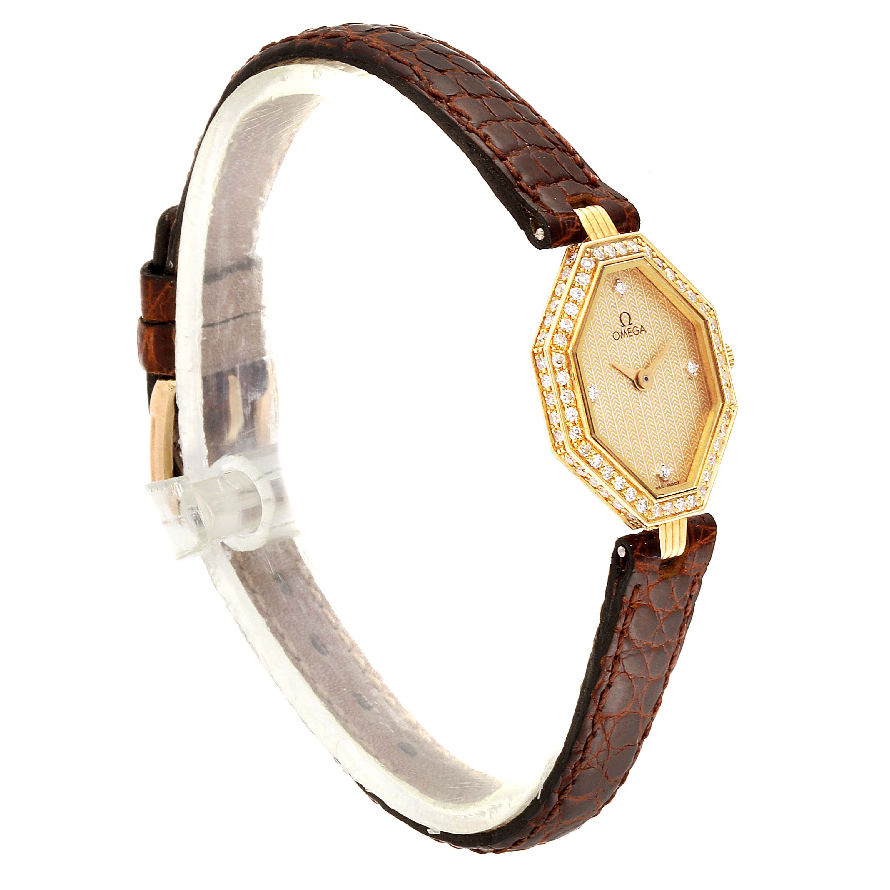 The Omega 1450 Women's Yellow Gold Champagne Dial 1450 Women's Yellow Gold Champagne Dial DeVille Mini Yellow Gold Diamond Cocktail Ladies Watch 1450 is shown at an angled side view, highlighting the face and strap.