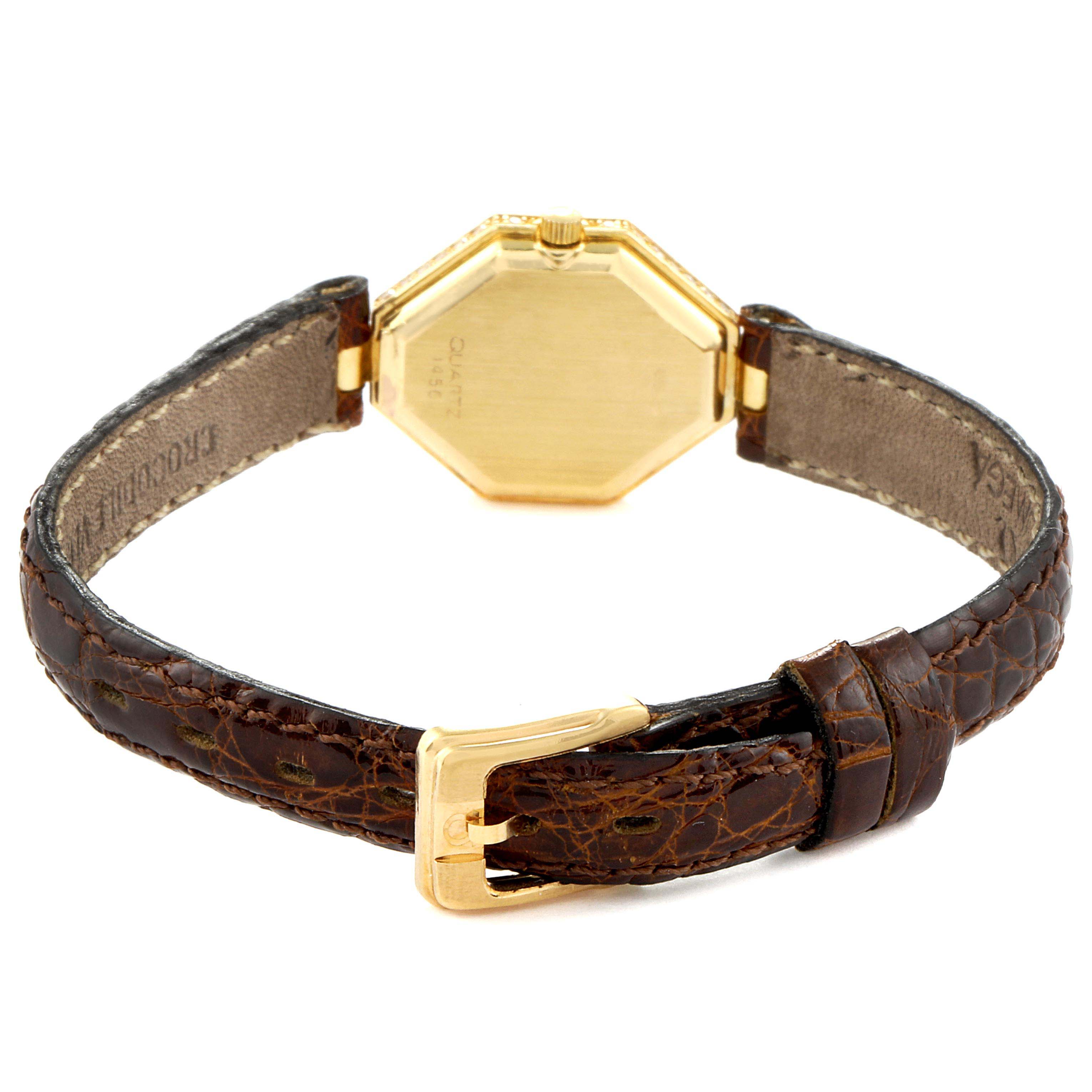 This image shows the back view of an Omega 1450 Women's Yellow Gold Champagne Dial 1450 Women's Yellow Gold Champagne Dial DeVille Mini Yellow Gold Diamond Cocktail Ladies Watch 1450, including its watch case, strap, and buckle.