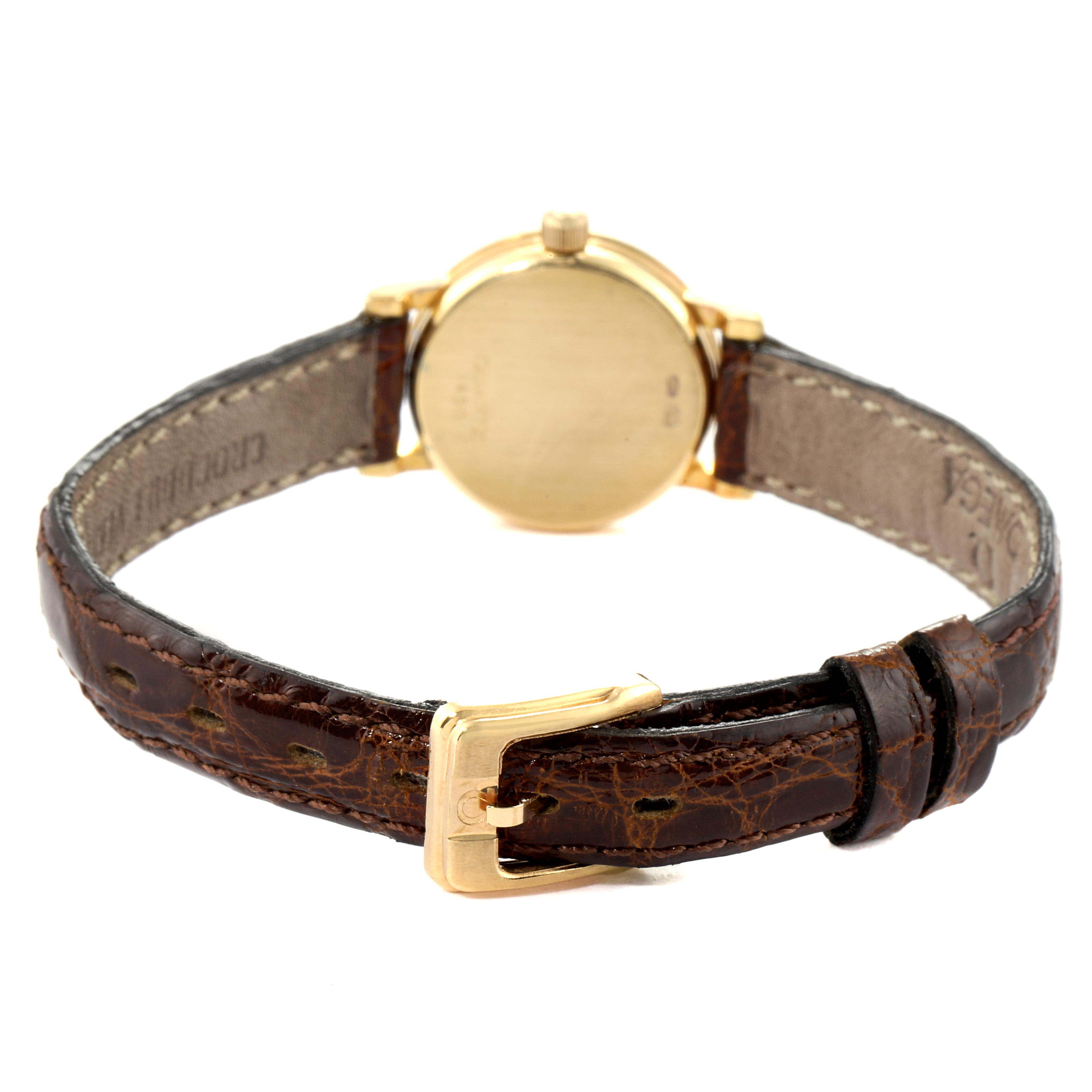 This image shows the back of the Omega 1450 Women
s Yellow Gold Champagne Dial 1450 Women
s Yellow Gold Champagne Dial DeVille Mini Yellow Gold Diamond Cocktail Ladies Watch 1450, highlighting the case back and strap.