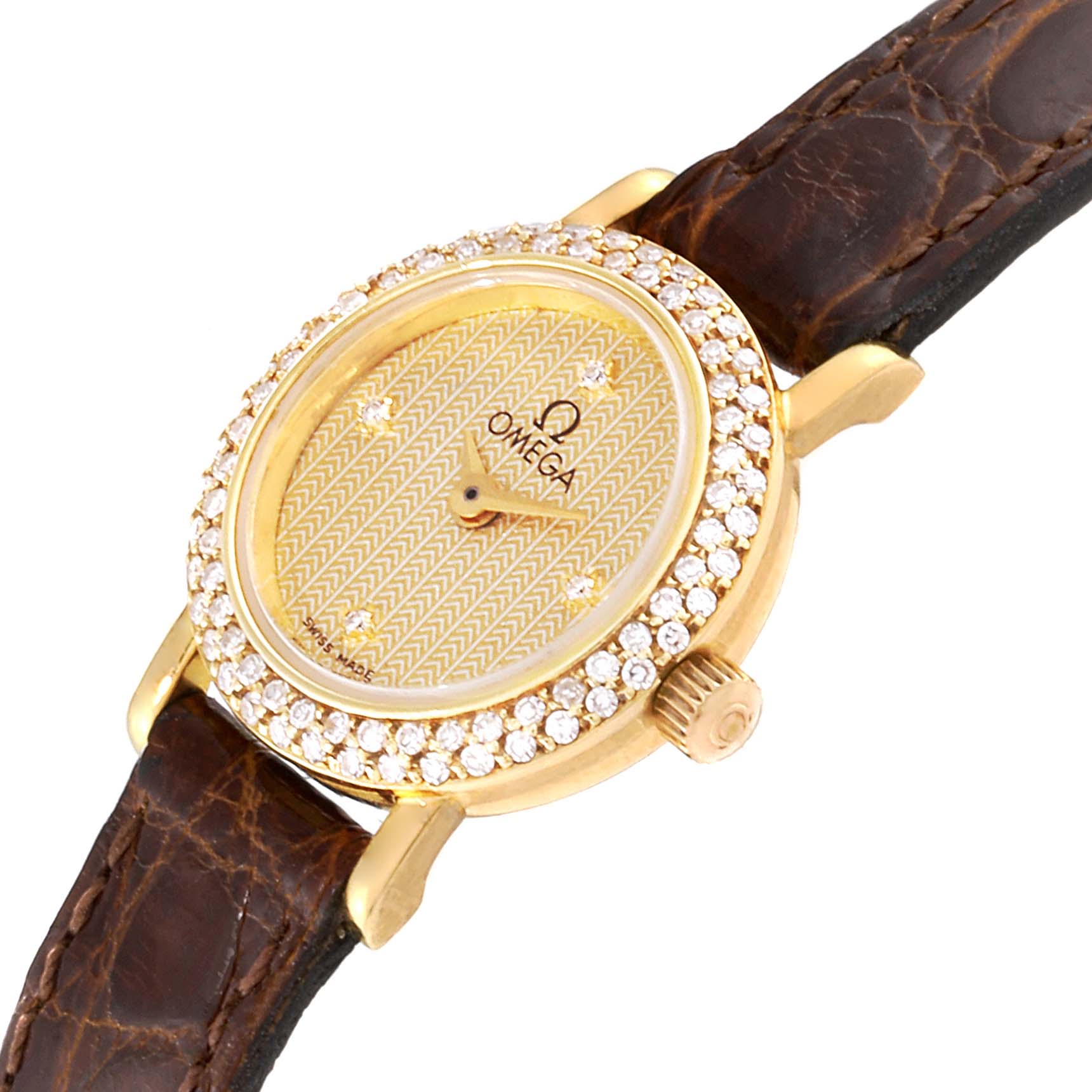 The image shows an angled view of the Omega 1450 Women
s Yellow Gold Champagne Dial 1450 Women
s Yellow Gold Champagne Dial DeVille Mini Yellow Gold Diamond Cocktail Ladies Watch 1450, highlighting the dial, bezel, and crown.