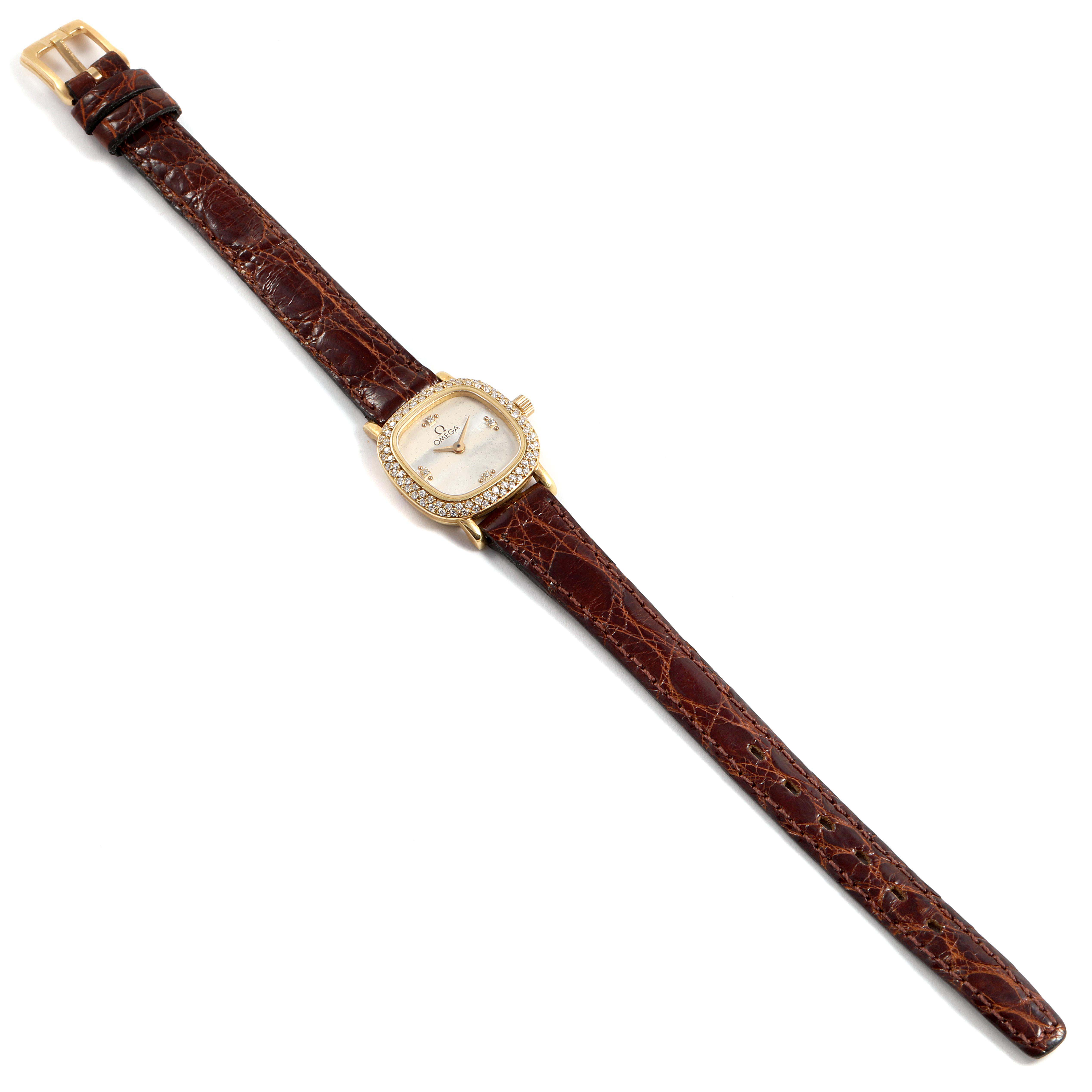 This image shows a DeVille Mini Yellow Gold Diamond Cocktail Ladies Watch 1450 by Omega 1450 Women's Yellow Gold Silver Dial 1450 Women's Yellow Gold Silver Dial, displayed from a top-down angle showcasing the entire strap and face.