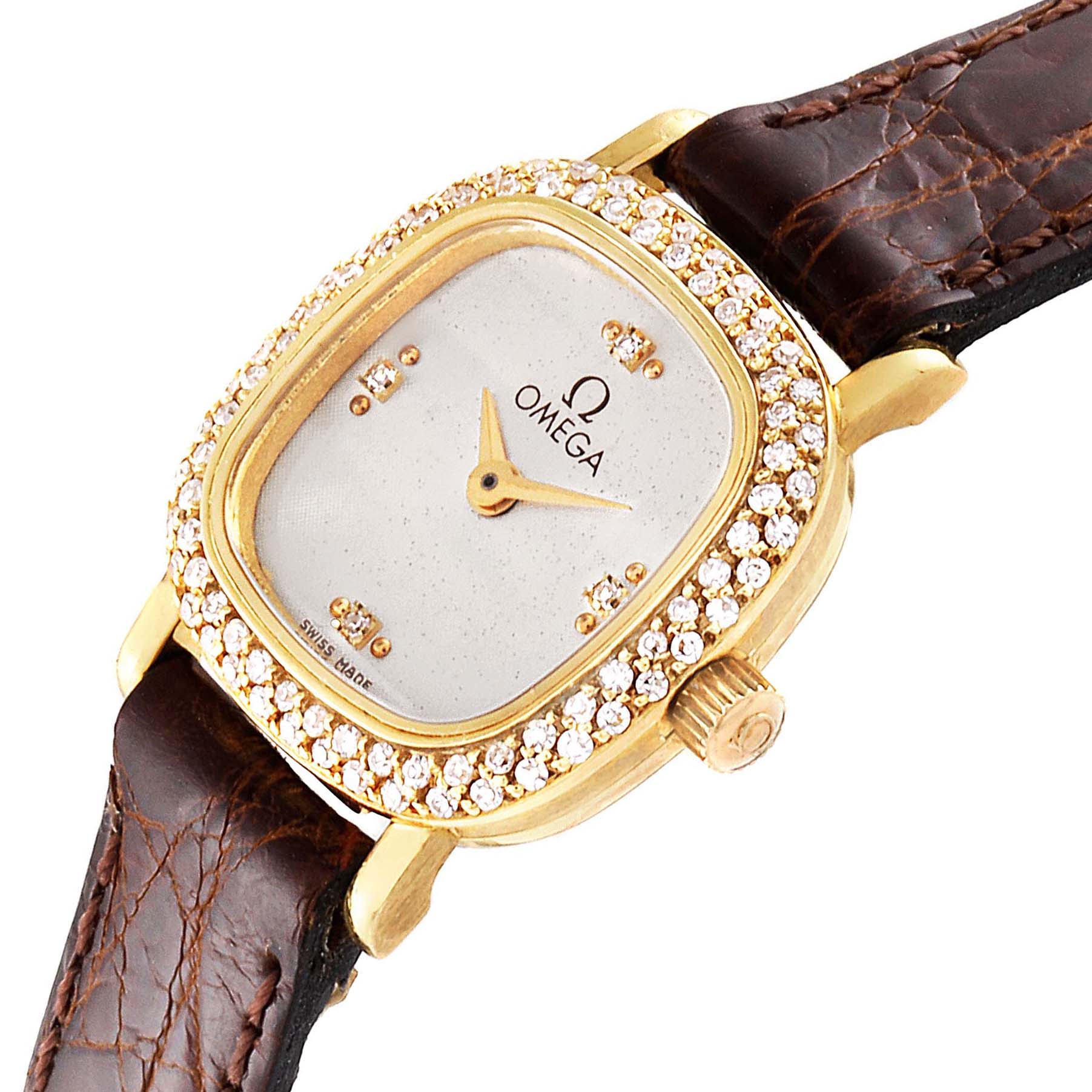 This image shows an angled view of the Omega 1450 Women's Yellow Gold Silver Dial 1450 Women's Yellow Gold Silver Dial DeVille Mini Yellow Gold Diamond Cocktail Ladies Watch 1450, focusing on the dial and diamond bezel.