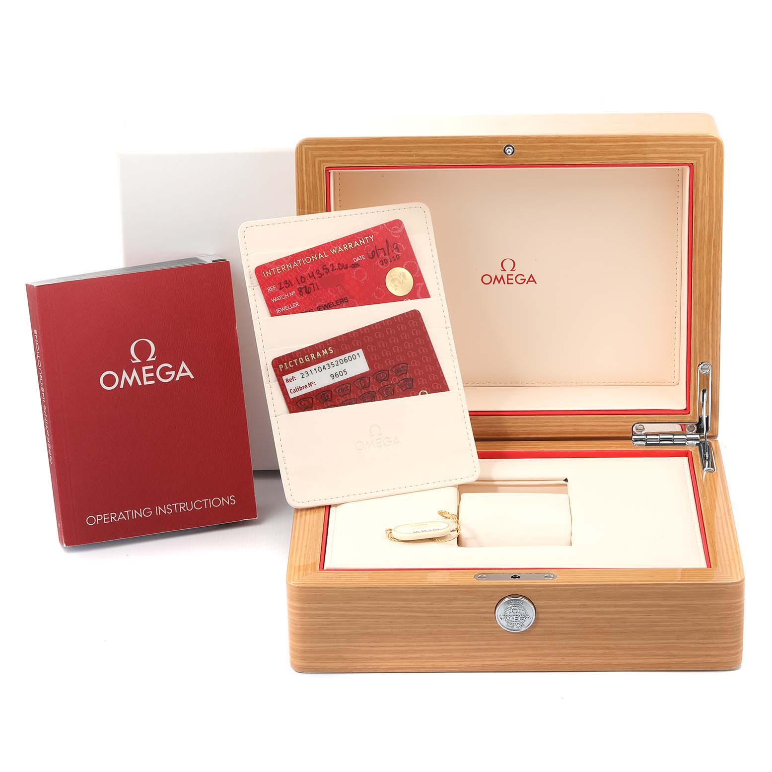 The image shows the Omega Aqua Terra 231.10.43.52.06.001 Men's Stainless Steel Black Dial 231.10.43.52.06.001 Men's Stainless Steel Black Dial watch box, operating instructions, warranty cardholder, and accessories from a front angle.