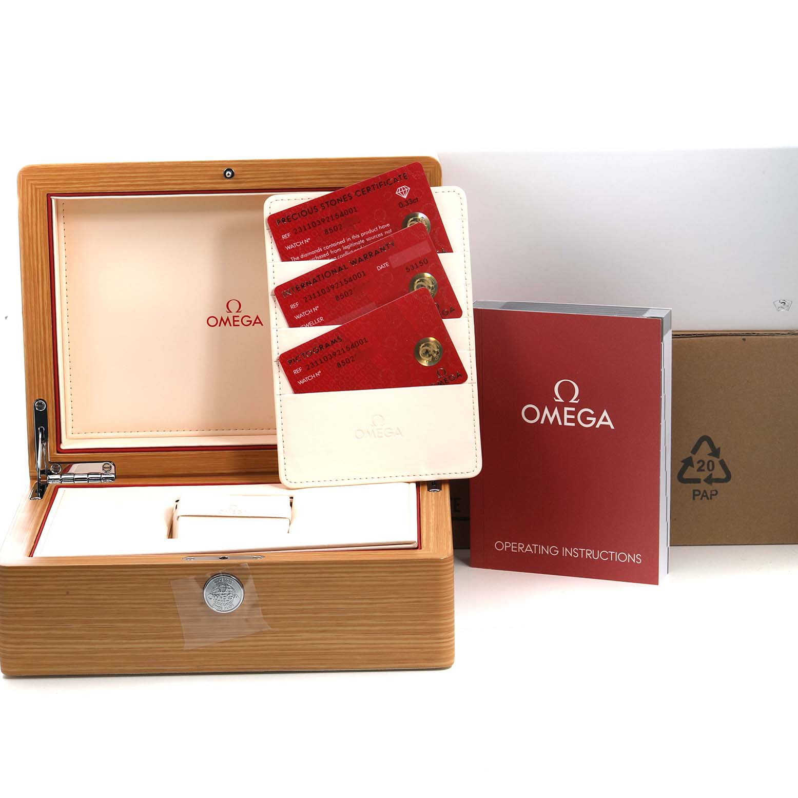 The image shows an Omega Aqua Terra 231.10.39.21.54.001 Men's Stainless Steel White Dial watch box, cards, and operating instructions, viewed from the front.