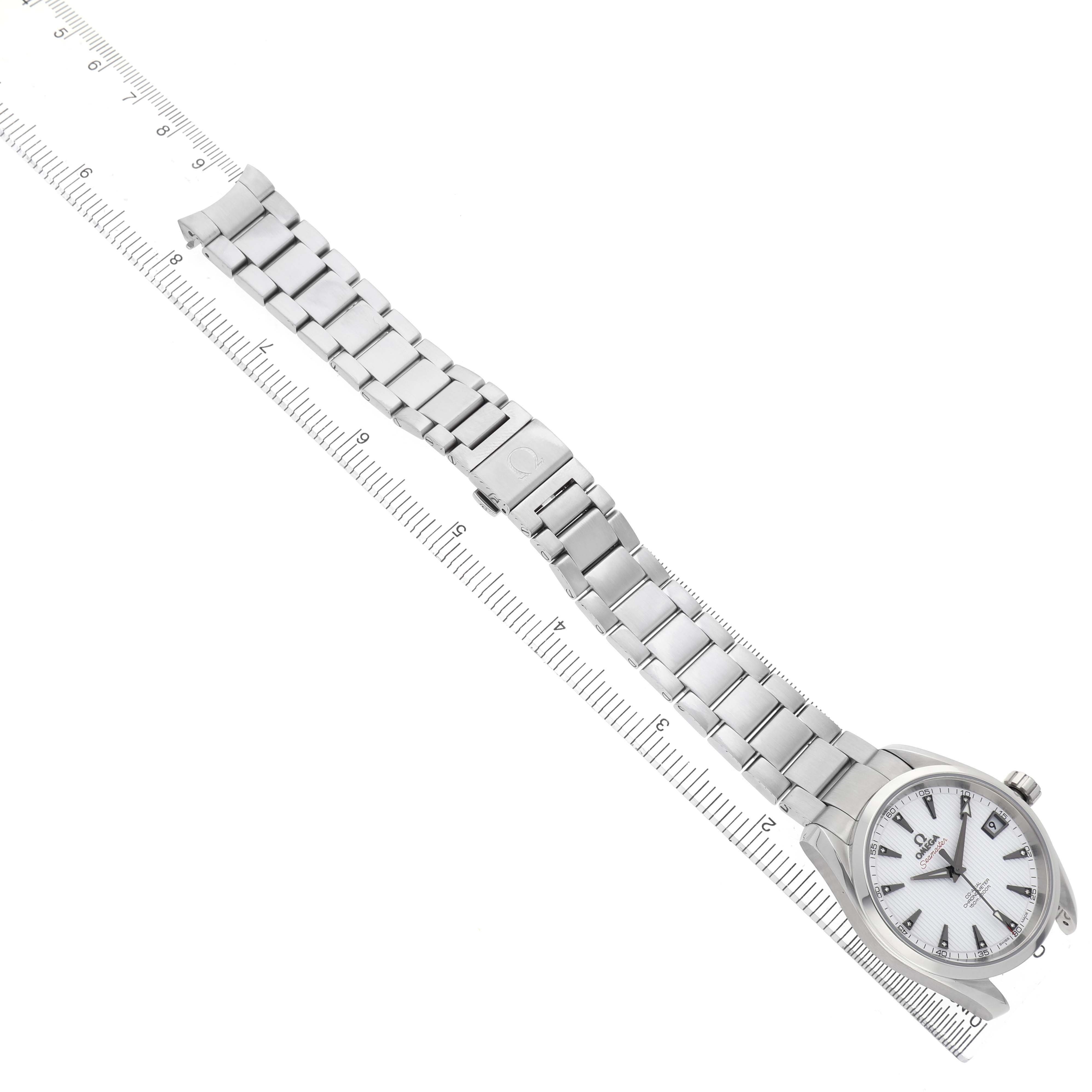 The Omega Aqua Terra 231.10.39.21.54.001 Men's Stainless Steel White Dial watch is shown from a top angle, highlighting the face and full metal bracelet with a ruler for scale.