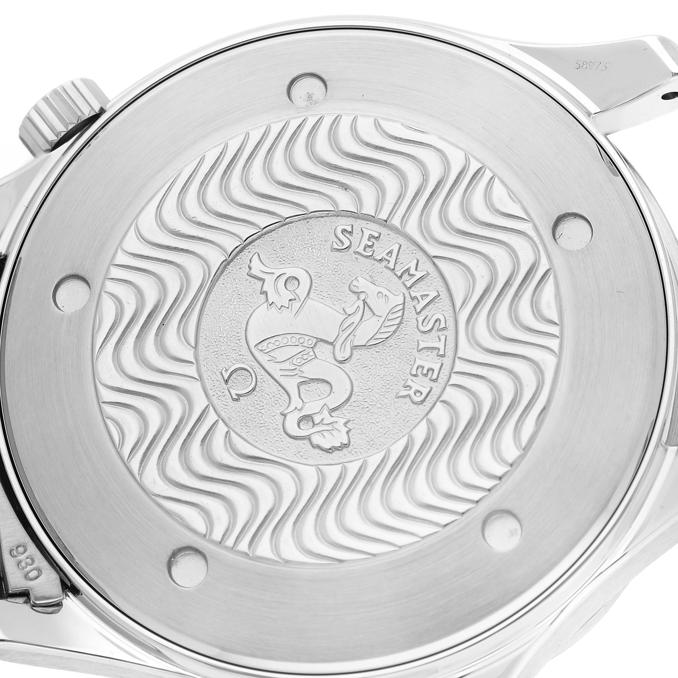 This image shows the case back of an Omega Seamaster 63020 Men
s Stainless Steel Blue Dial 63020 Men
s Stainless Steel Blue Dial watch, featuring its engraved logo and wave pattern design.