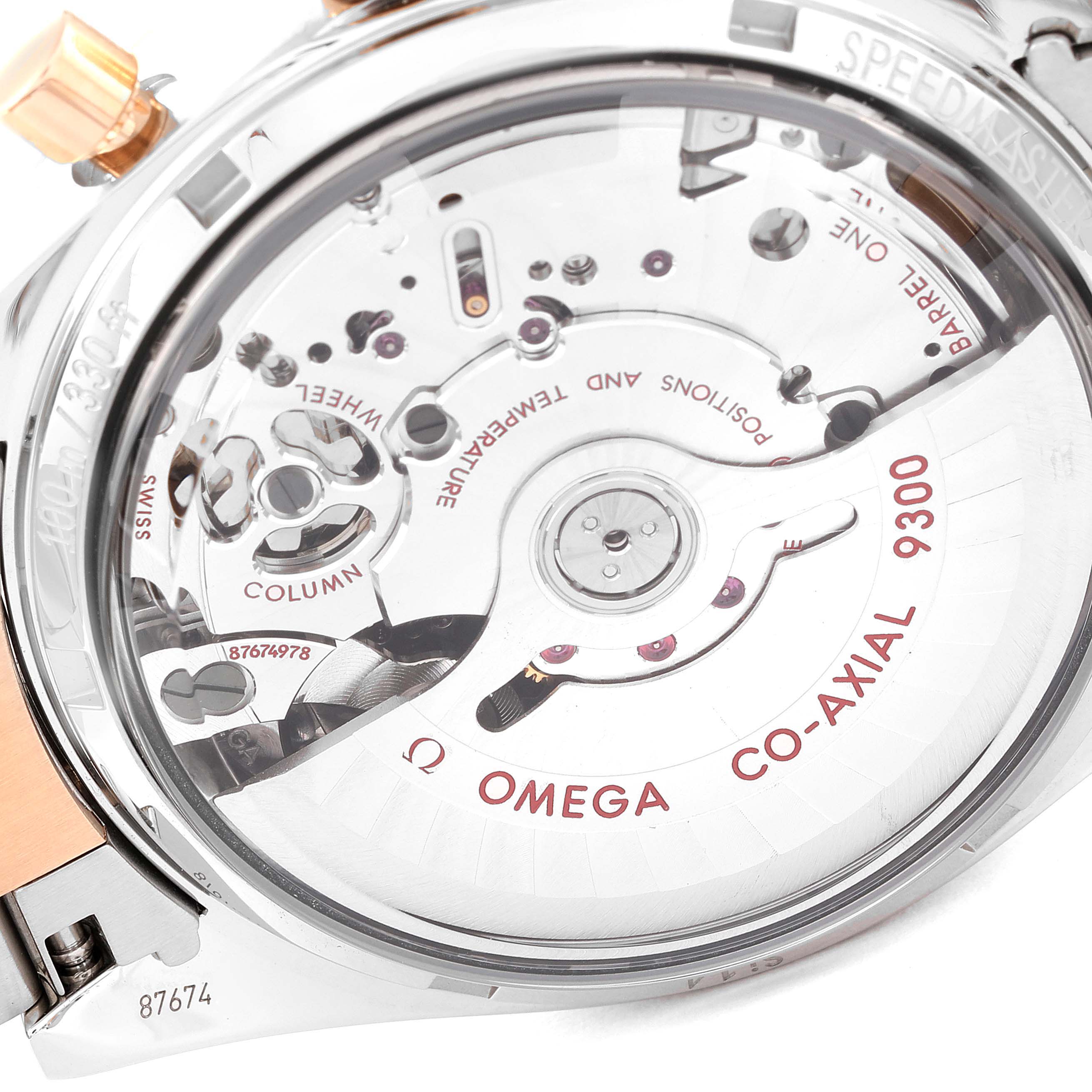 The image shows the case back and the internal movement of the Omega Speedmaster 331.20.42.51.01.002 Men's Steel and Gold (two tone) Black Dial 331.20.42.51.01.002 Men's Steel and Gold (two tone) Black Dial, highlighting the Co-Axial 9300 mechanism.