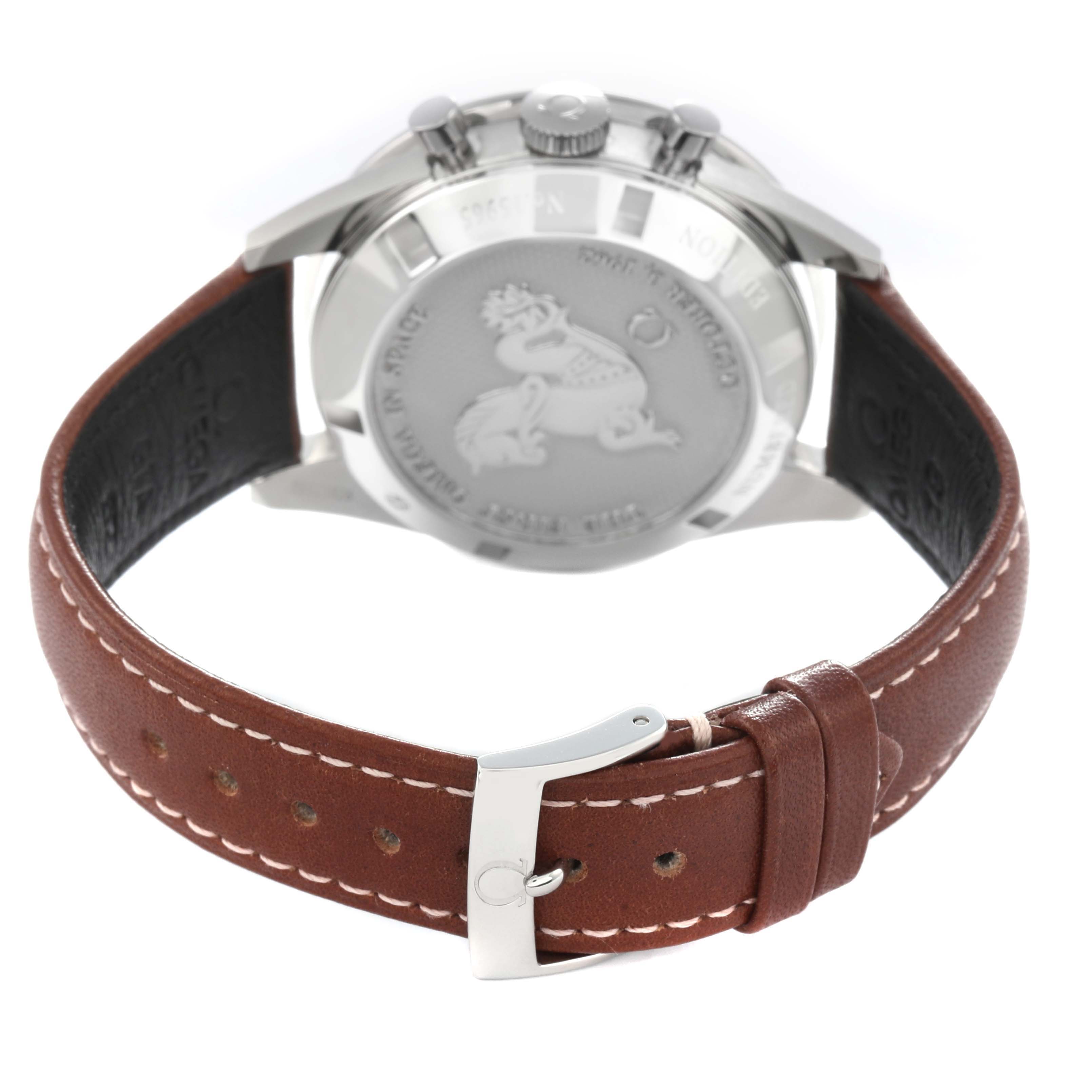 The image shows the back view of the Omega Speedmaster model 311.32.40.30.01.001, highlighting the case back, pushers, and brown leather strap with stitching.