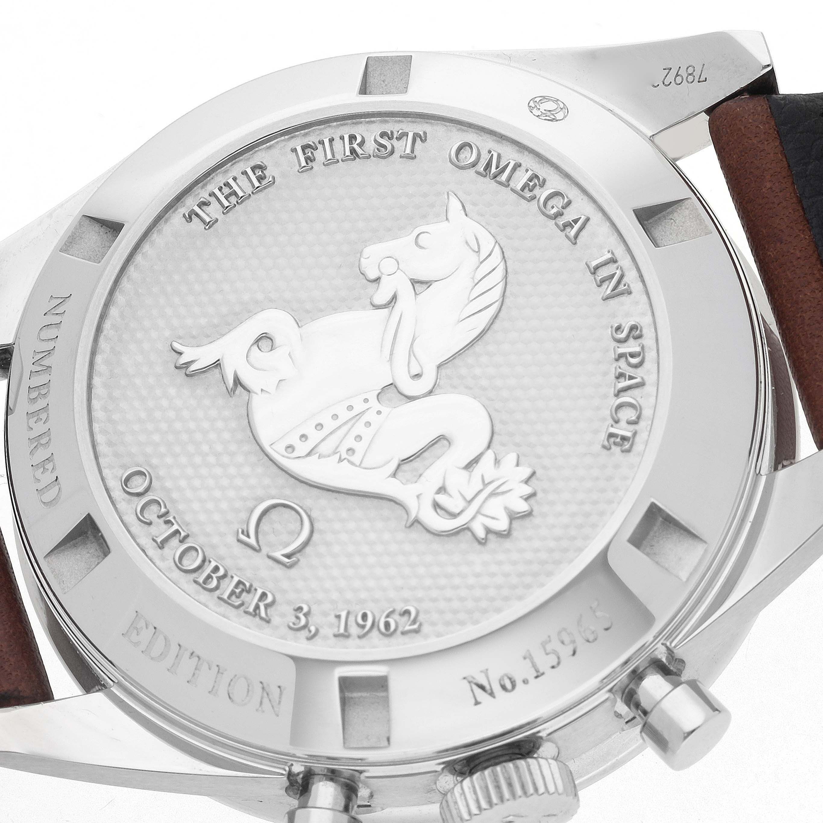 The image shows the back case of the Omega Speedmaster, model number 311.32.40.30.01.001, featuring an engraved design and the phrases "THE FIRST OMEGA IN SPACE" and "OCTOBER 3, 1962."