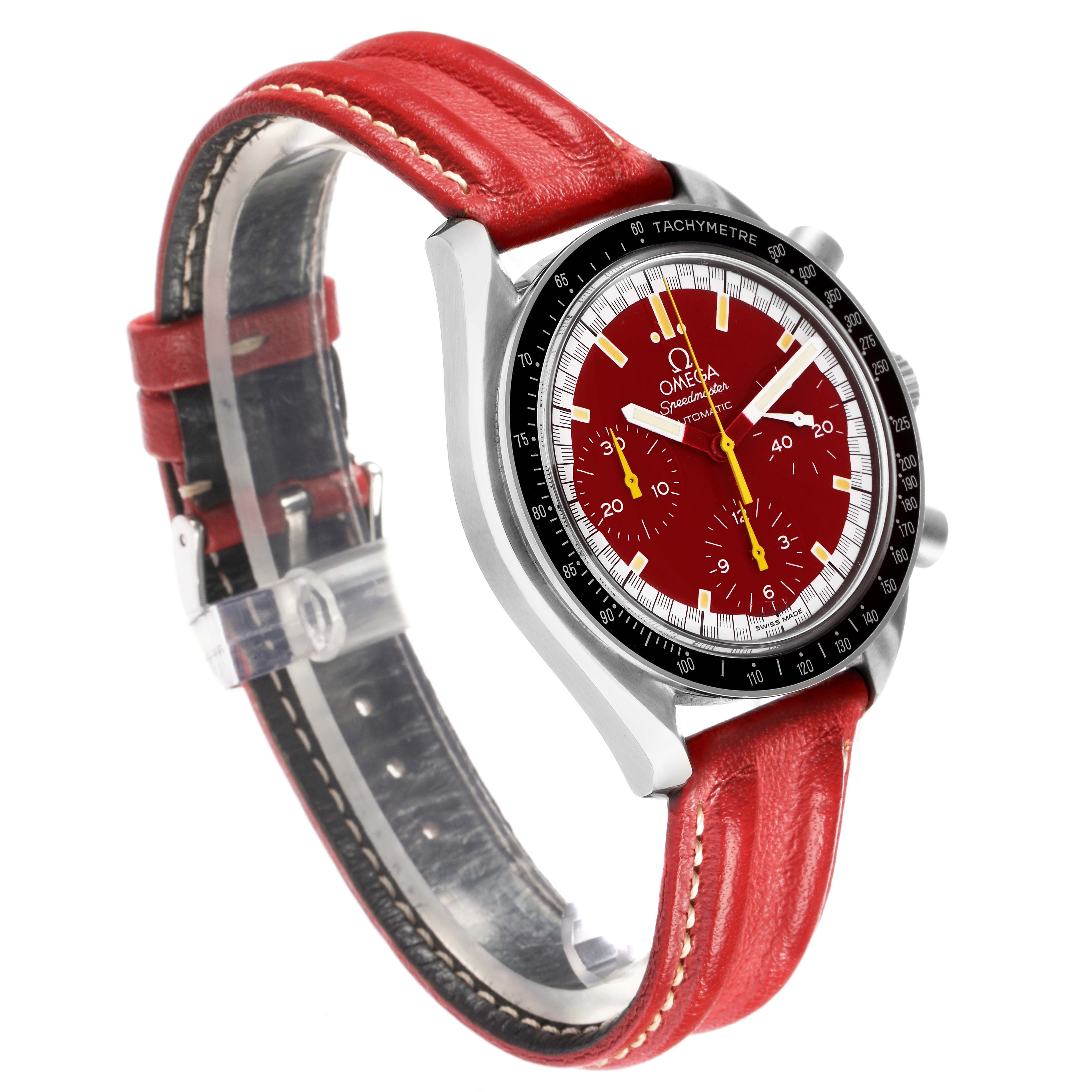 The Omega Speedmaster 3810.61.41 men's watch is shown from a three-quarter angle, highlighting its red dial, tachymetre bezel, and red leather strap.