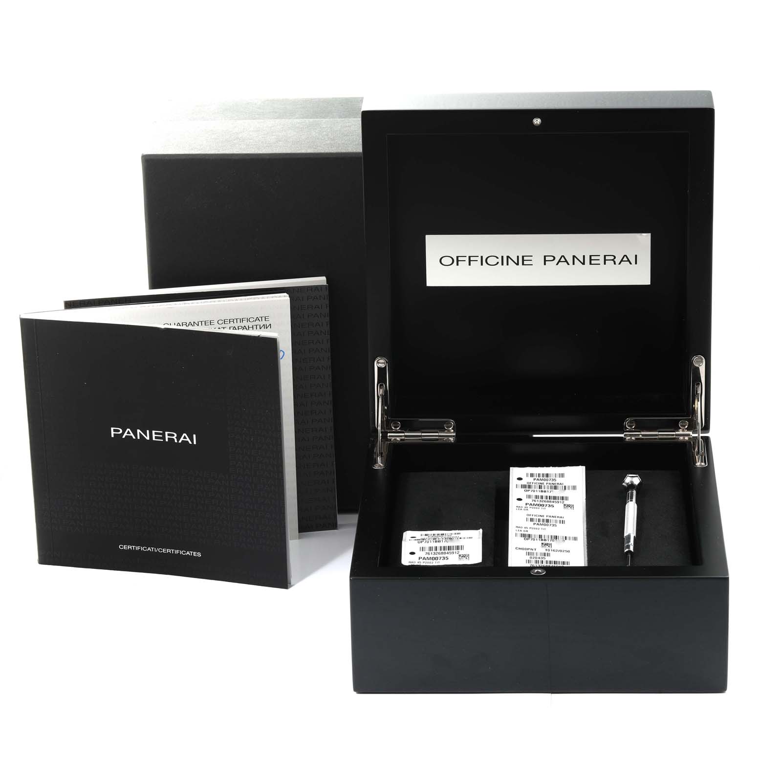 The image shows the open box and accessories of a Panerai Radiomir PAM00735 Men's Titanium Green Dial PAM00735 Men's Titanium Green Dial watch, including certificates and a tool.