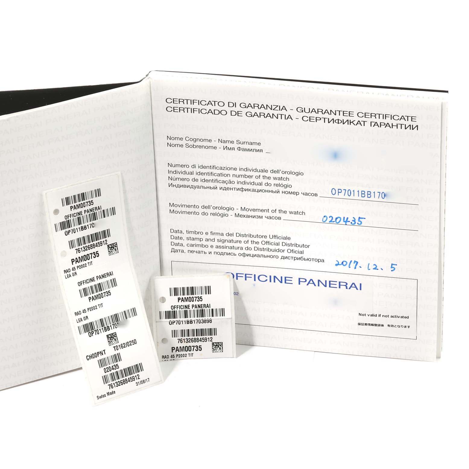 The image shows the guarantee certificate and product tags for a Panerai Radiomir PAM00735 Men's Titanium Green Dial PAM00735 Men's Titanium Green Dial model watch.