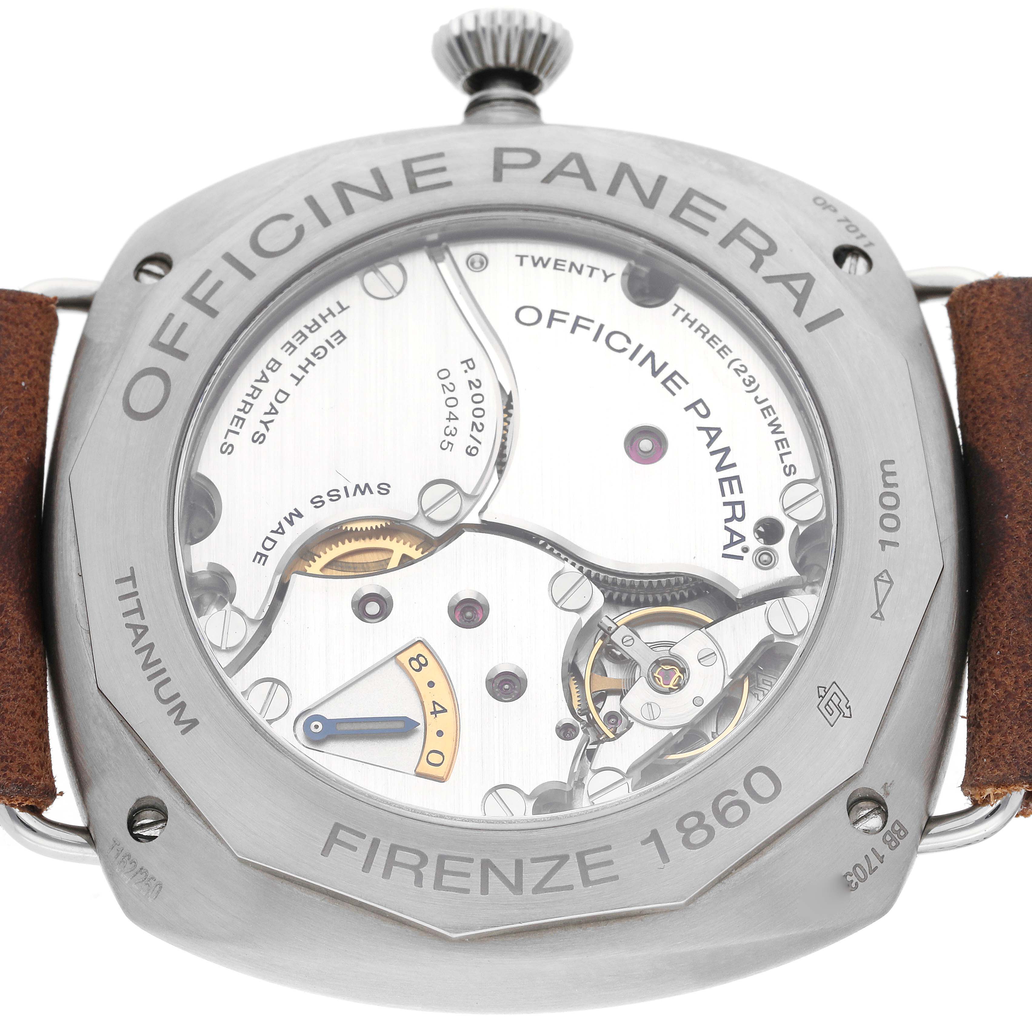 The image shows the back of a Panerai Radiomir PAM00735 Men's Titanium Green Dial PAM00735 Men's Titanium Green Dial watch, highlighting its internal mechanics and engravings on the case.