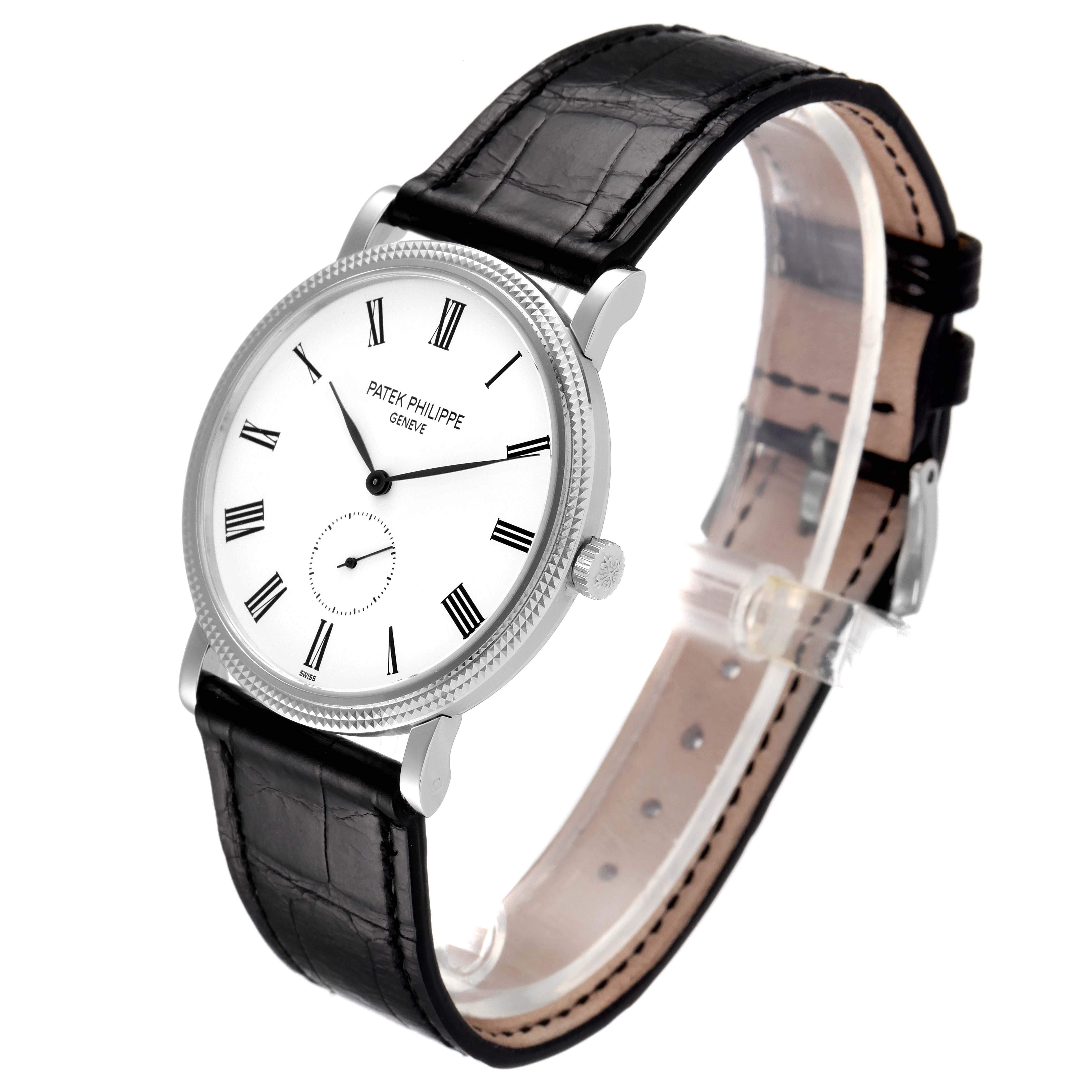 The Patek Philippe Calatrava 5119G Men's White Gold White Dial 5119G Men's White Gold White Dial model watch is shown from an angled side view, highlighting its face, bezel, case, crown, and leather strap.