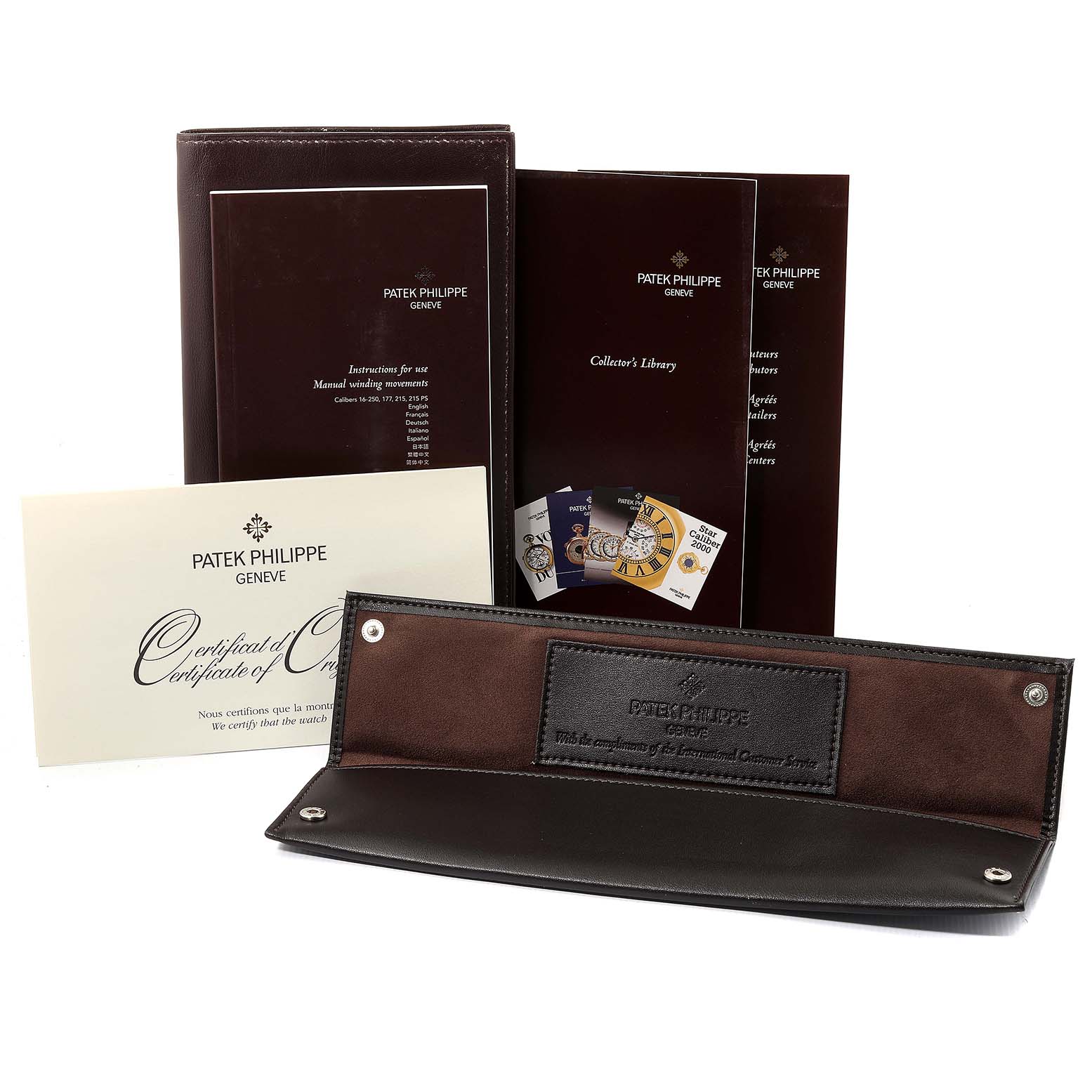 The image shows the instruction manuals, certificate, and a leather pouch for the Patek Philippe Calatrava 5119G Men's White Gold White Dial 5119G Men's White Gold White Dial watch.