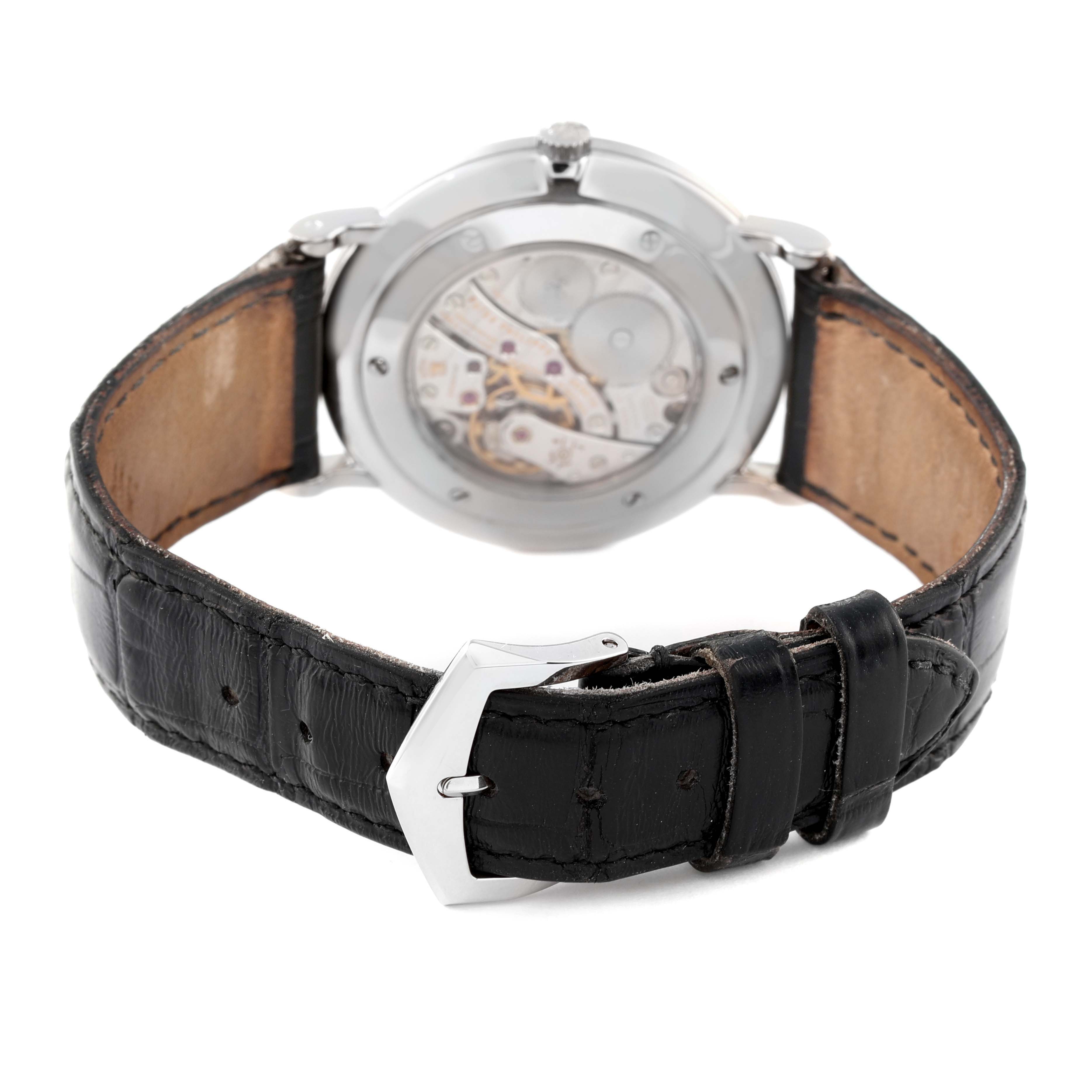 The image shows the back view of a Patek Philippe Calatrava 5119G Men's White Gold White Dial 5119G Men's White Gold White Dial watch, highlighting the movement through the transparent caseback and the leather strap.