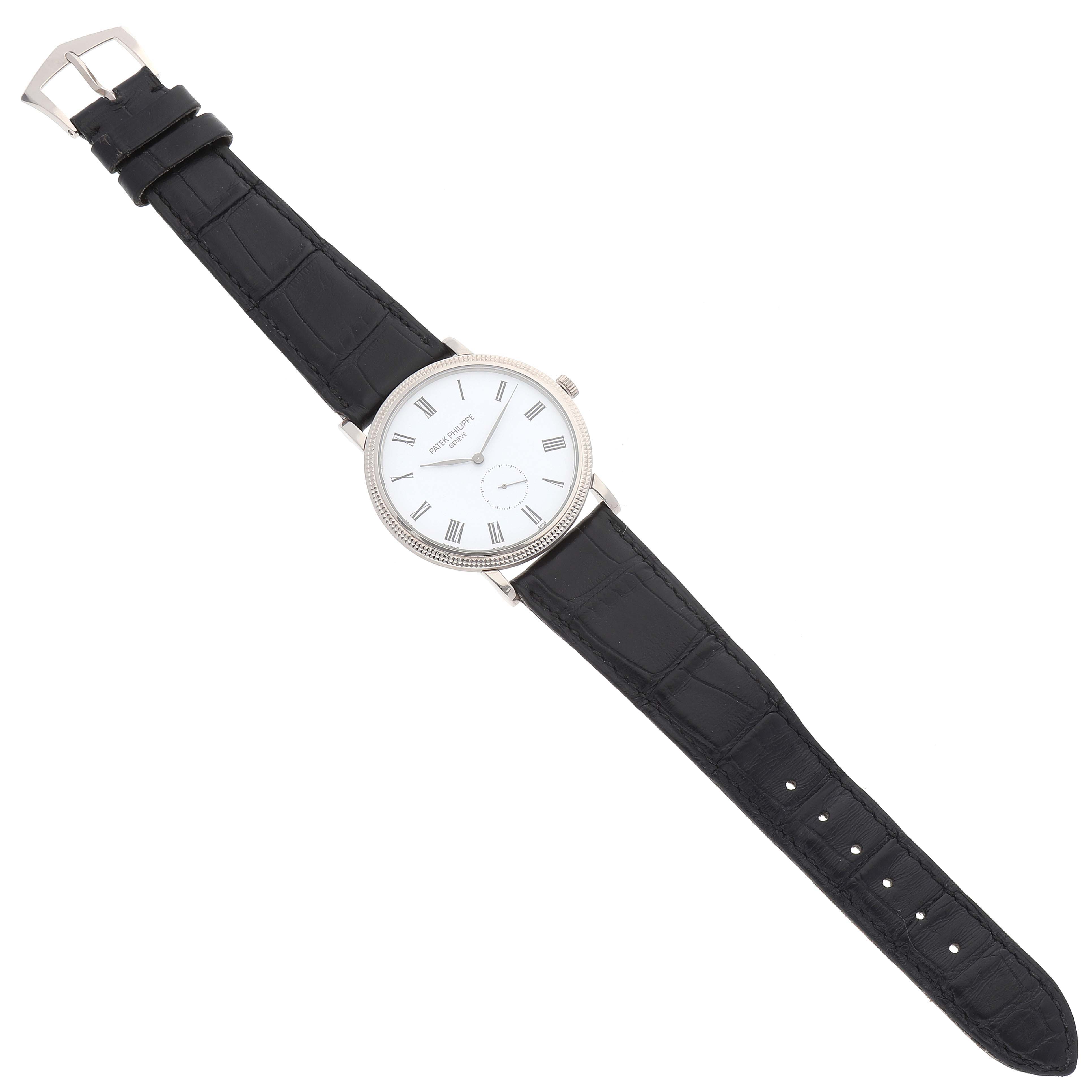 The image shows a Patek Philippe Calatrava 5119G Men's White Gold White Dial 5119G Men's White Gold White Dial watch from a top-down angle, displaying the face, bezel, crown, and black leather strap.