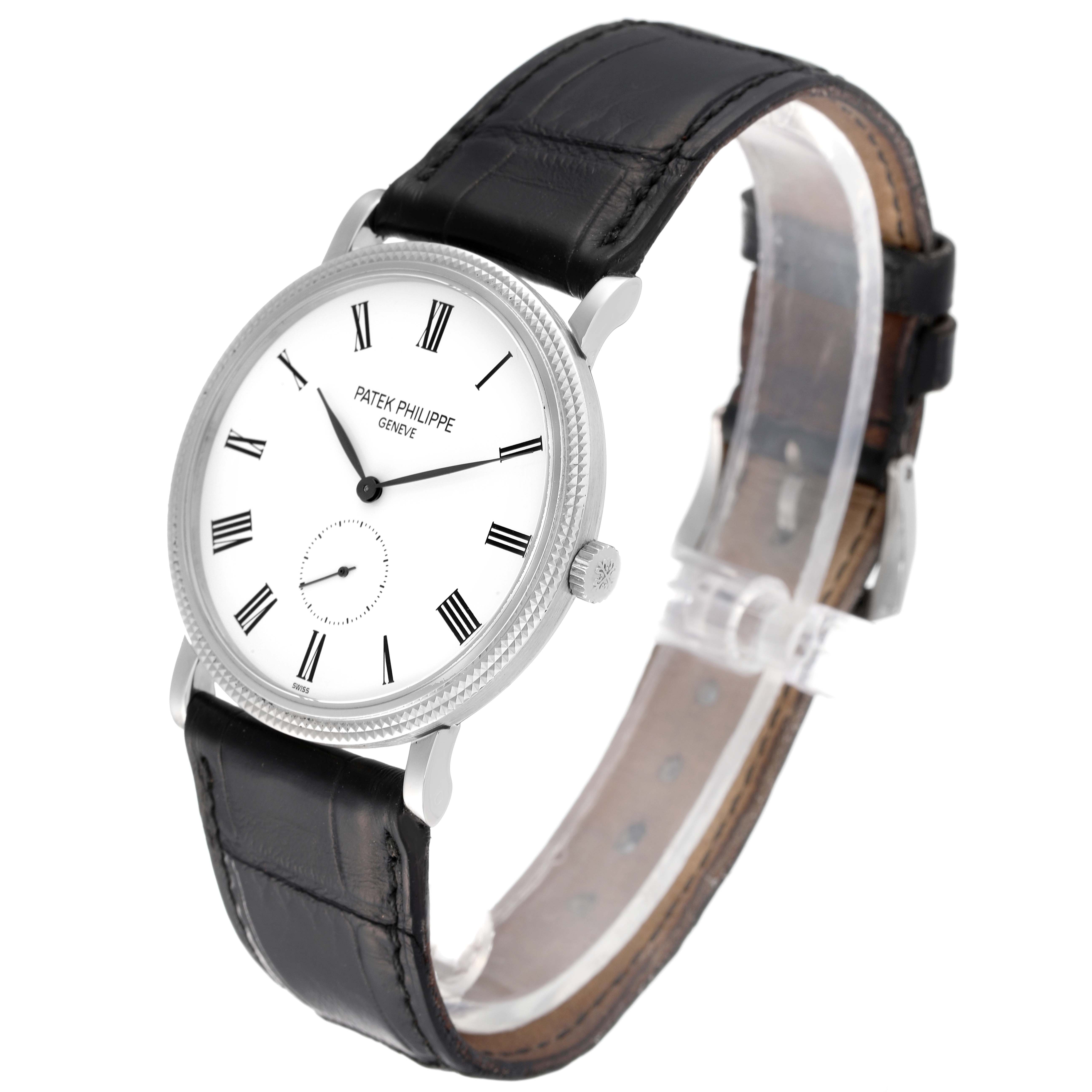 The image shows a Patek Philippe Calatrava 5119G Men's White Gold White Dial 5119G Men's White Gold White Dial watch at a slight angle, highlighting its white dial, black leather strap, and Roman numerals.