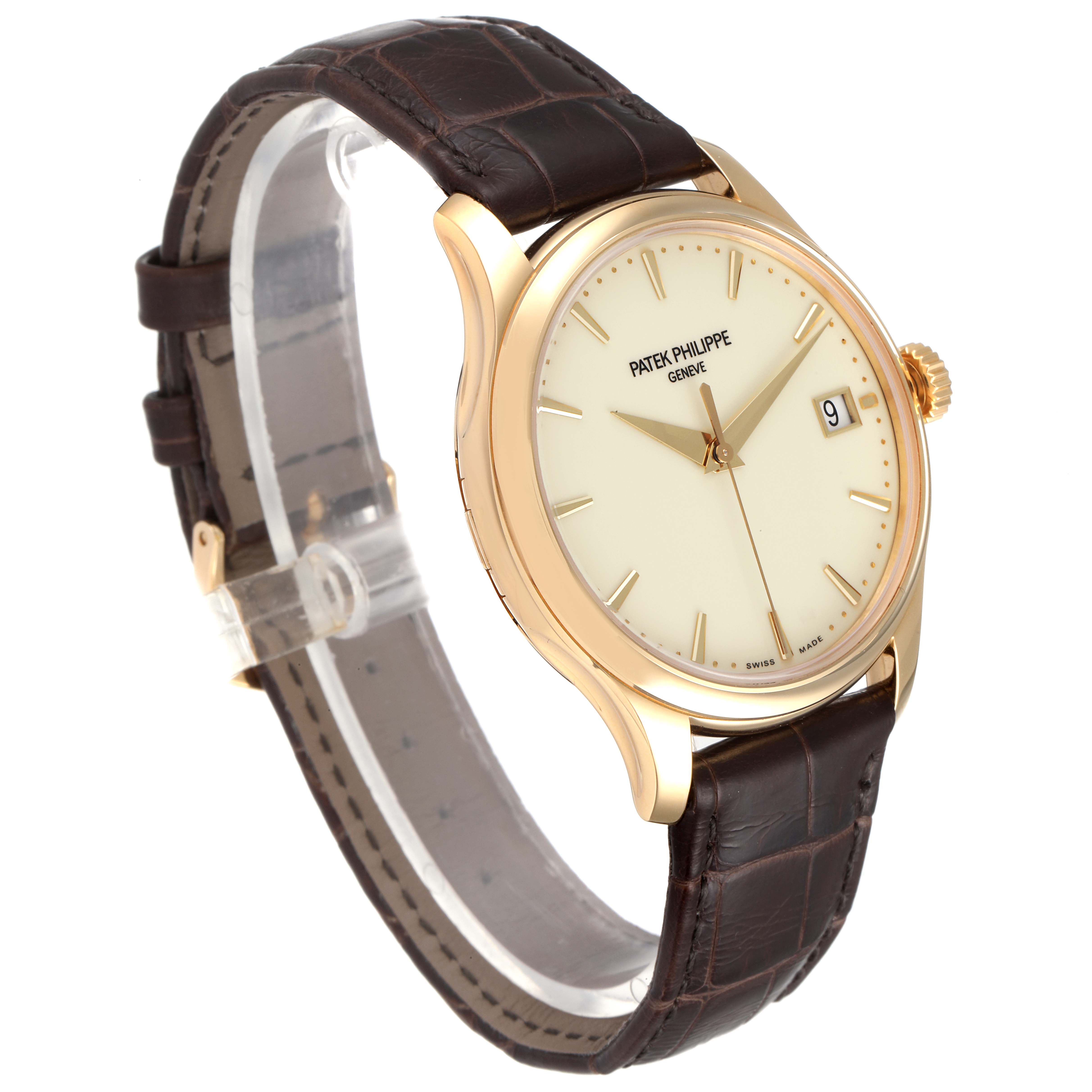 This image shows a side-angle view of a Patek Philippe Calatrava 5227J-001 Men's Yellow Gold Beige Dial 5227J-001 Men's Yellow Gold Beige Dial watch, showcasing its face, strap, and crown.