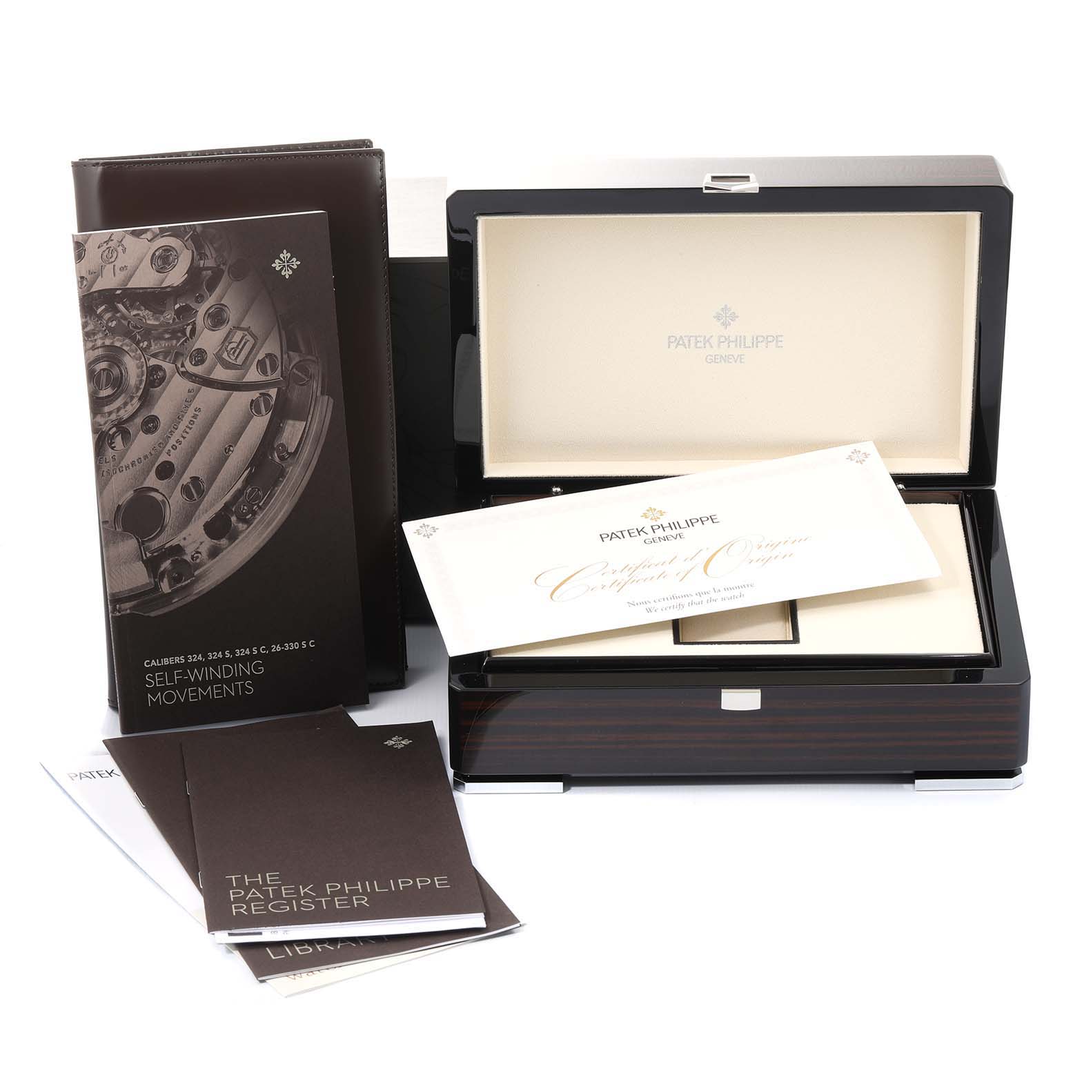 The image shows a Patek Philippe Calatrava 5227J-001 Men's Yellow Gold Beige Dial 5227J-001 Men's Yellow Gold Beige Dial watch box, certificates, and user manuals from a front angle.