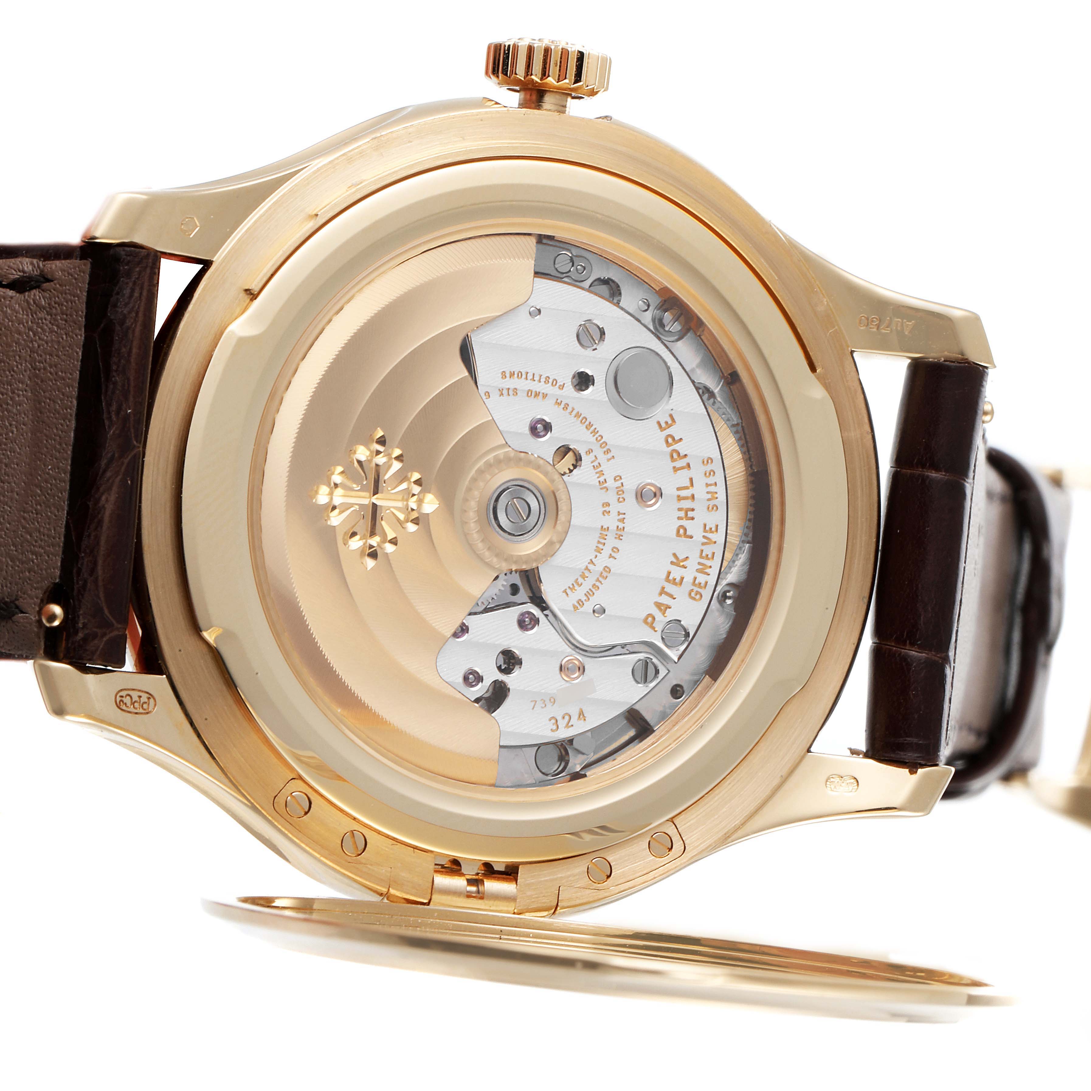The image shows the back view of a Patek Philippe Calatrava 5227J-001 Men's Yellow Gold Beige Dial 5227J-001 Men's Yellow Gold Beige Dial watch, displaying its movement and intricate internal mechanisms.