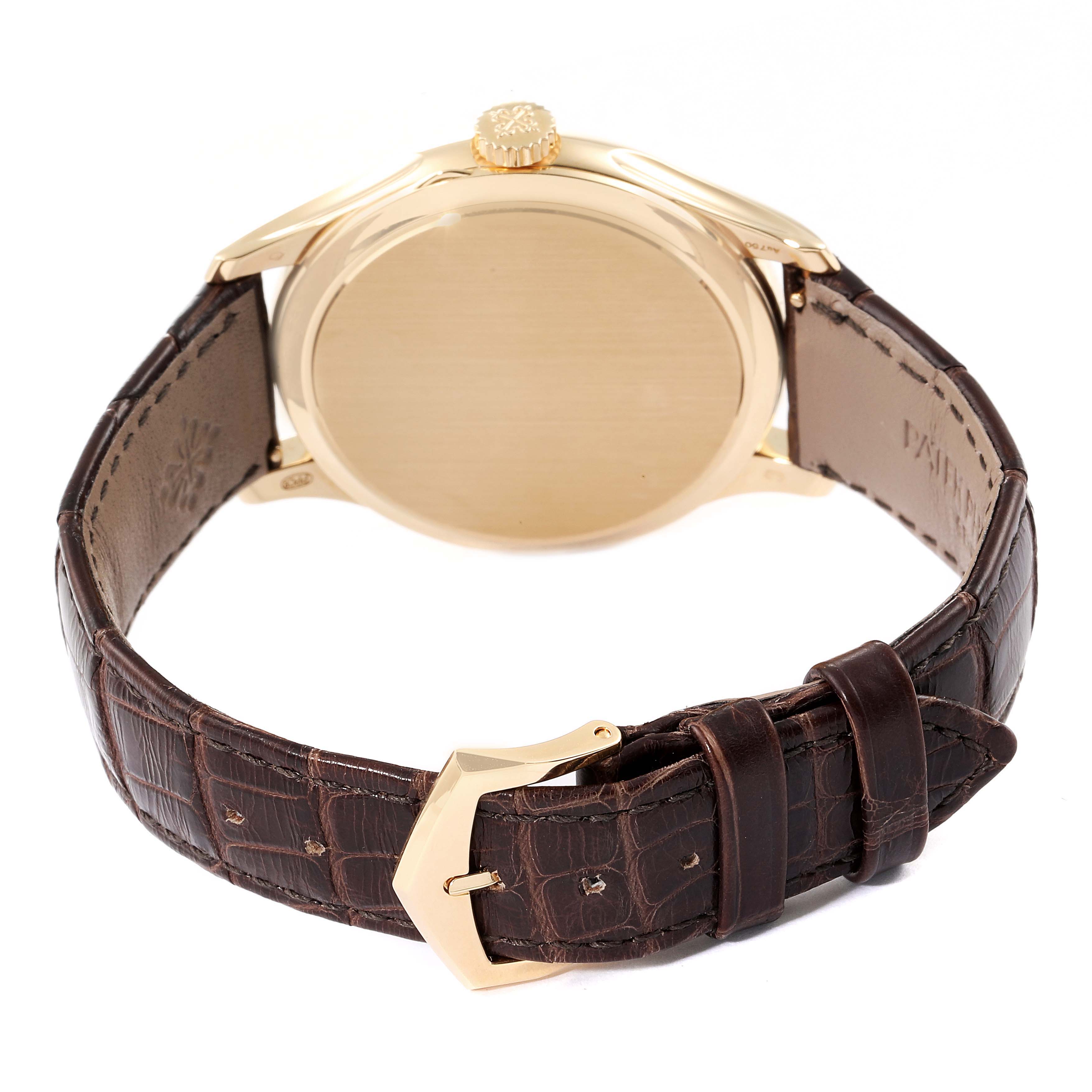 This image shows the back case and leather strap of a Patek Philippe Calatrava 5227J-001 Men's Yellow Gold Beige Dial 5227J-001 Men's Yellow Gold Beige Dial watch, viewed from the rear.