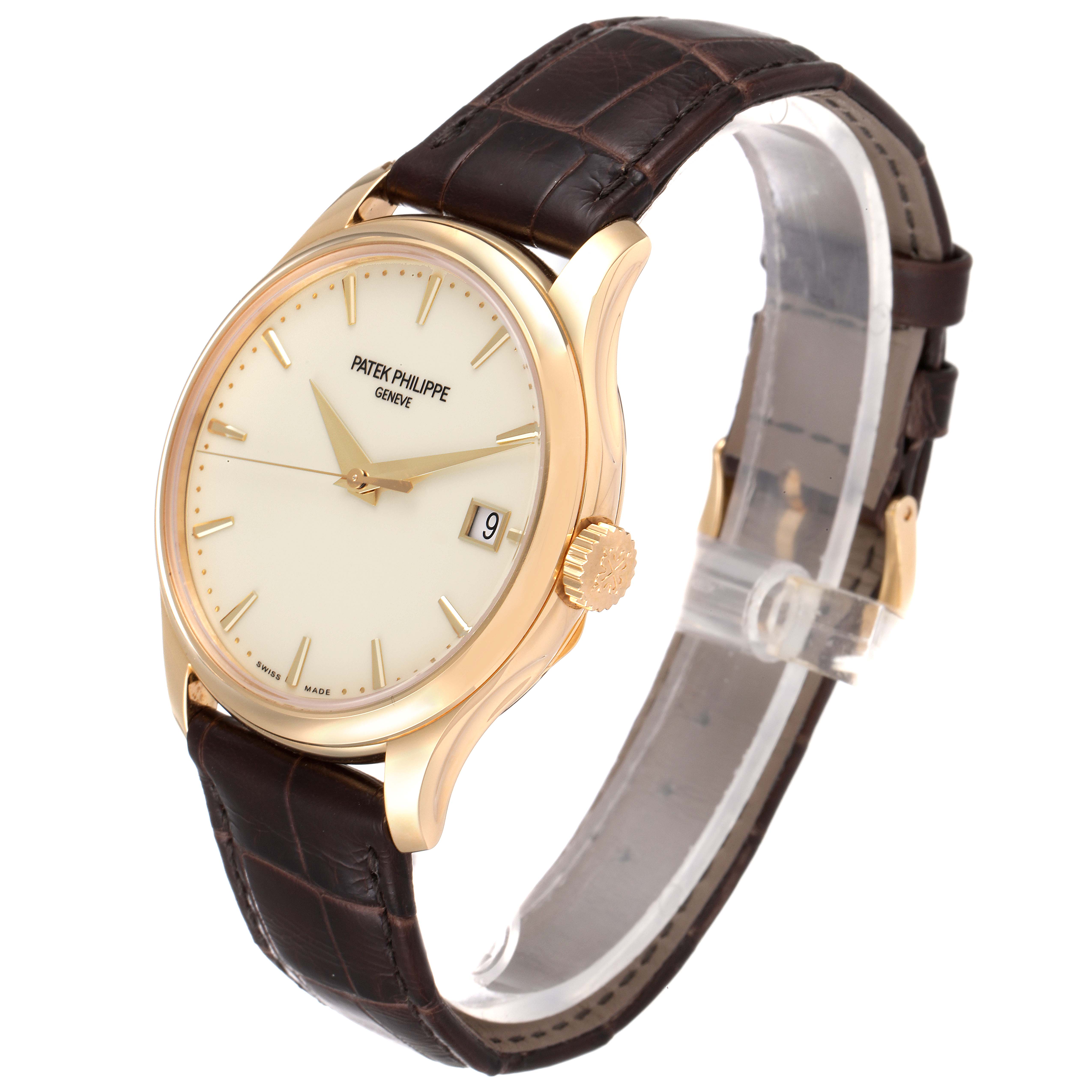 The image shows a side view of a Patek Philippe Calatrava 5227J-001 Men's Yellow Gold Beige Dial 5227J-001 Men's Yellow Gold Beige Dial watch, highlighting its dial, crown, and brown leather strap.