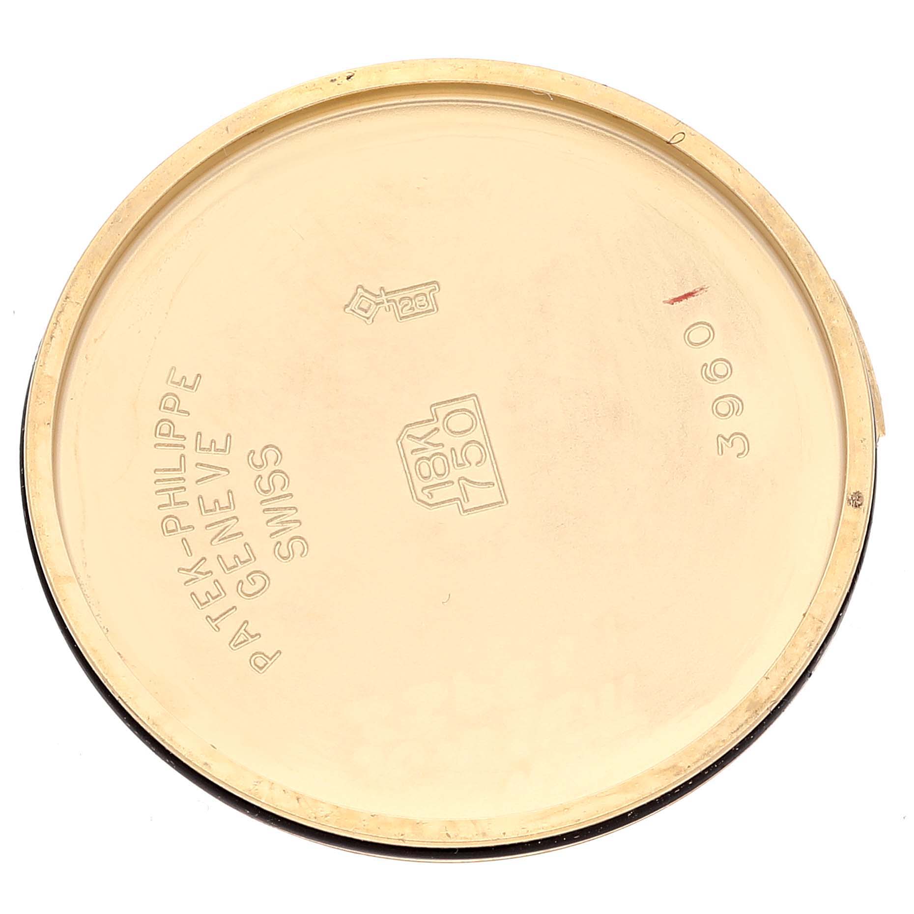 This is the inside view of the case back of a Patek Philippe Calatrava 3960J Men's Yellow Gold White Dial 3960J Men's Yellow Gold White Dial watch, model 3960, showing brand engravings and gold hallmarks.