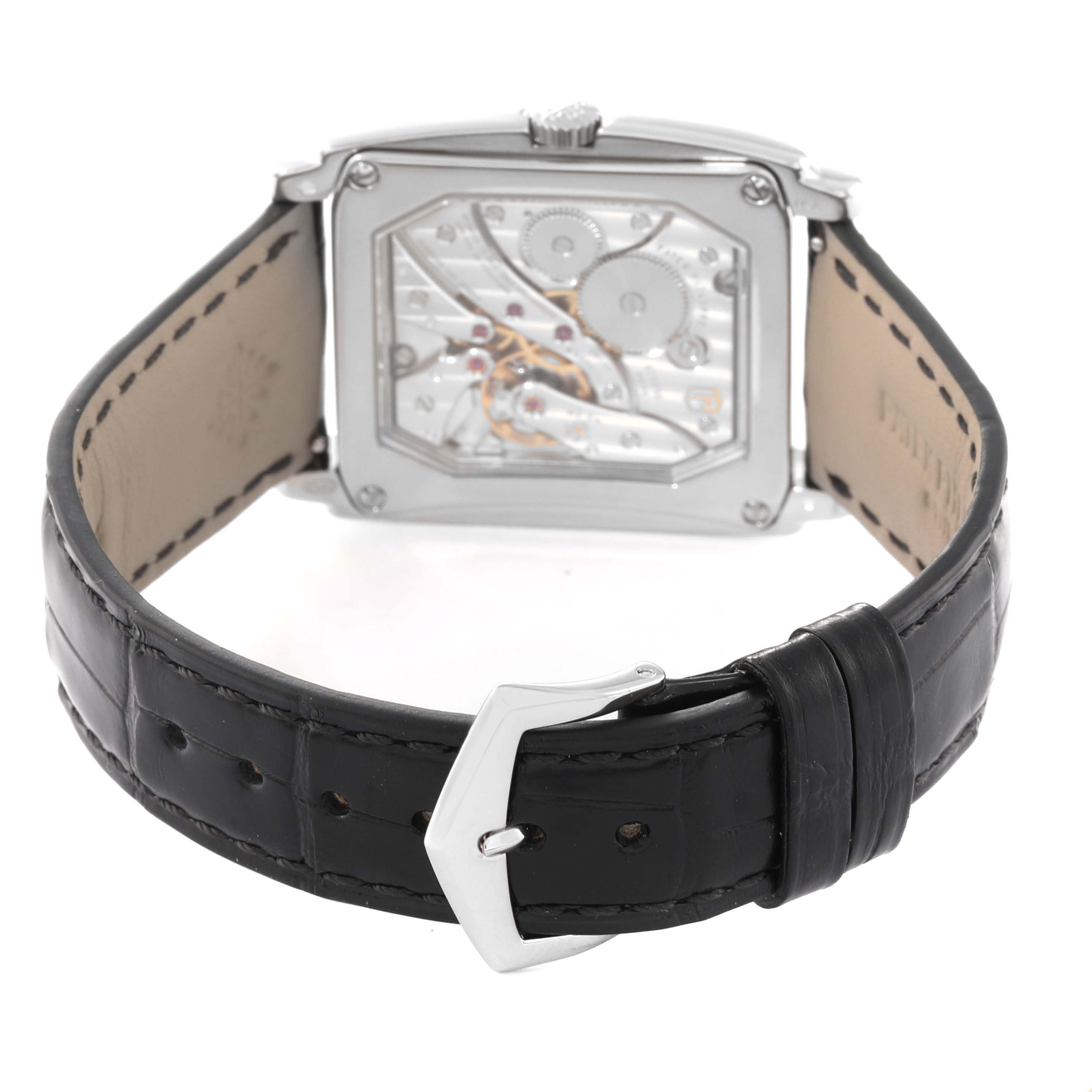 The image shows the back view of a Patek Philippe Gondolo 5124G-011 Men's White Gold Blue Dial 5124G-011 Men's White Gold Blue Dial watch with a black leather strap and visible inner mechanisms.