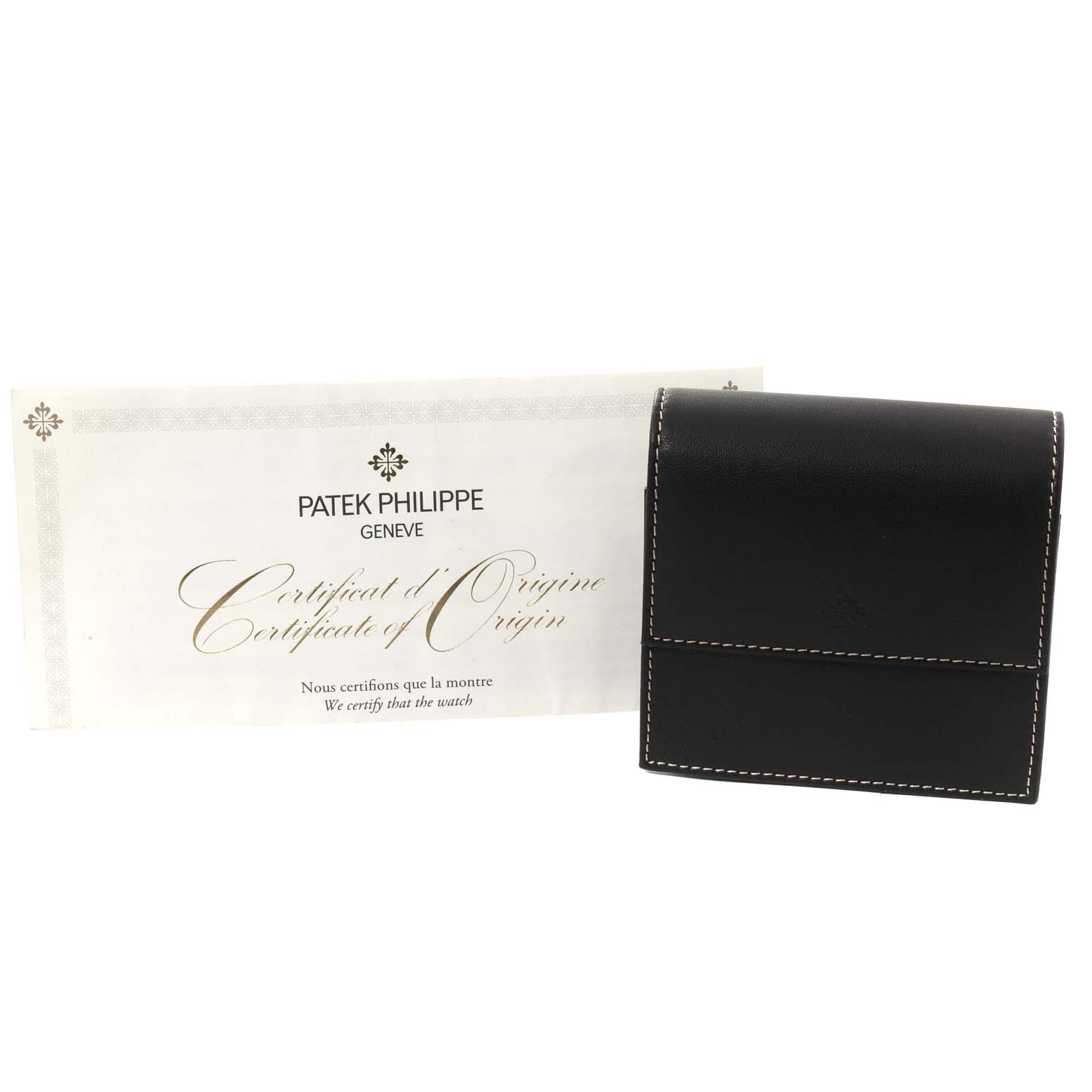 The image shows a Patek Philippe Gondolo 5124G-011 Men's White Gold Blue Dial 5124G-011 Men's White Gold Blue Dial watch's certificate of origin and a black leather case.