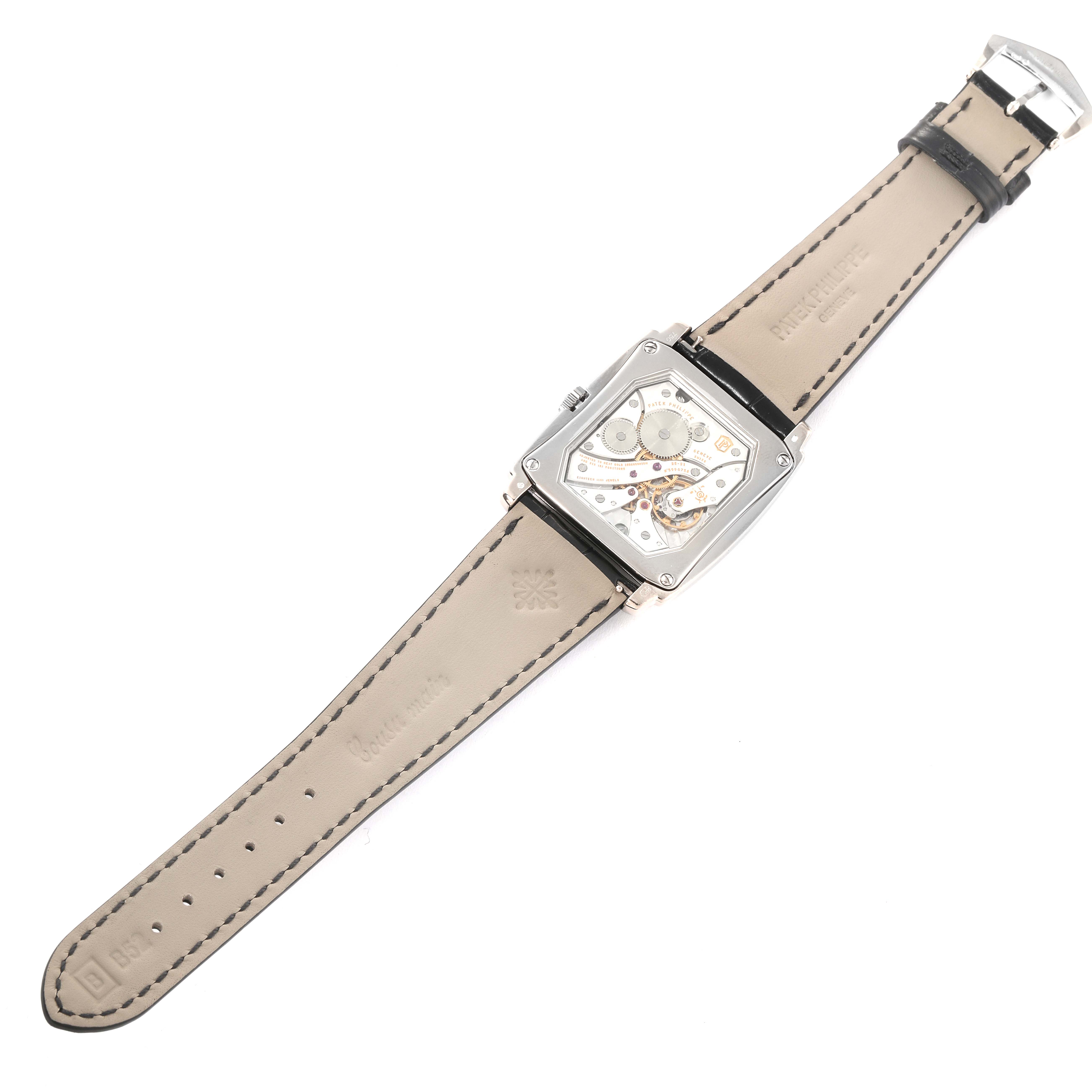 This image shows the back view of a Patek Philippe Gondolo 5124G-011 Men's White Gold Blue Dial 5124G-011 Men's White Gold Blue Dial watch, displaying its movement and leather strap.