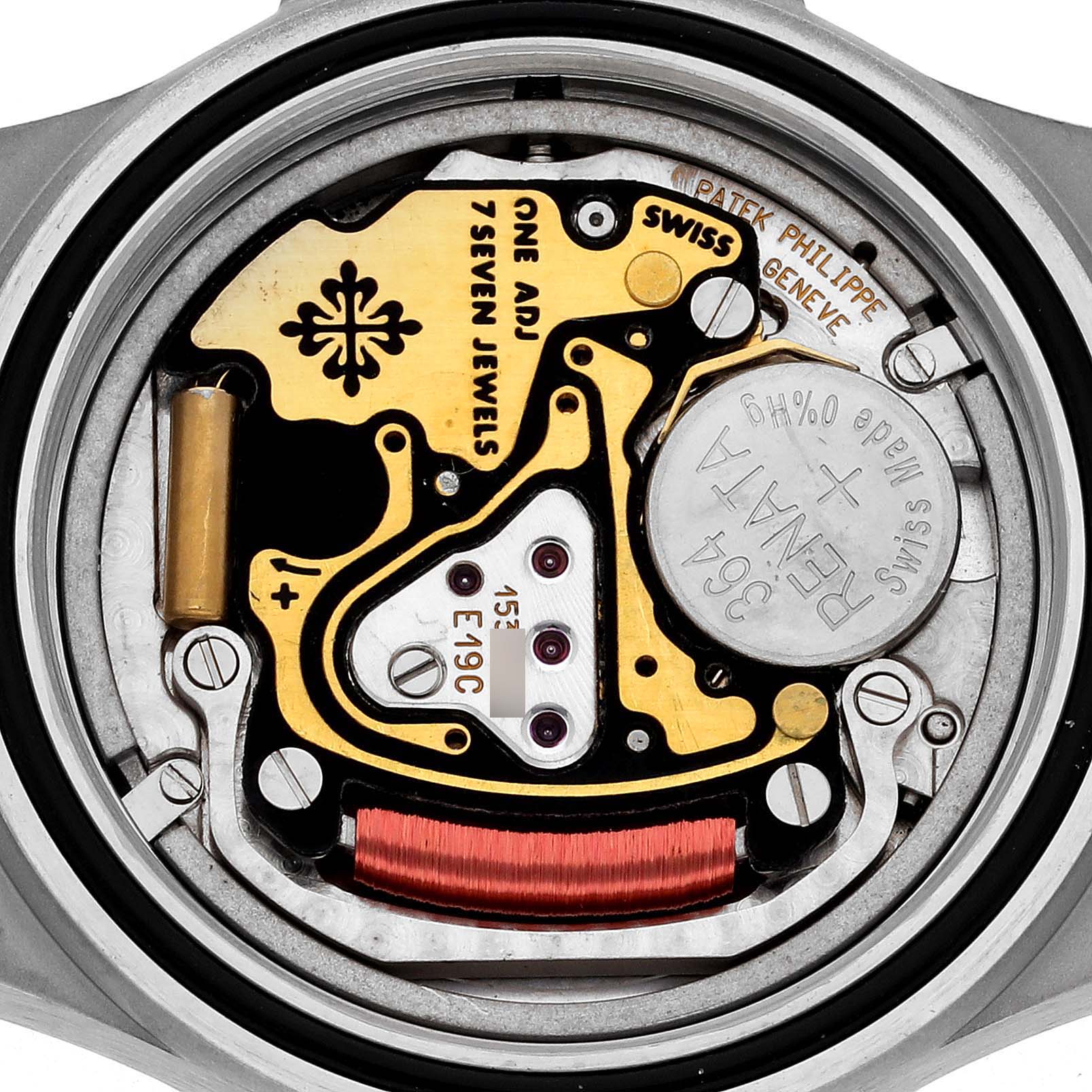 The image shows the inner mechanism of a Patek Philippe Neptune 4880/1A Women's Stainless Steel Black Dial 4880/1A Women's Stainless Steel Black Dial model watch, displaying its battery and intricate components.