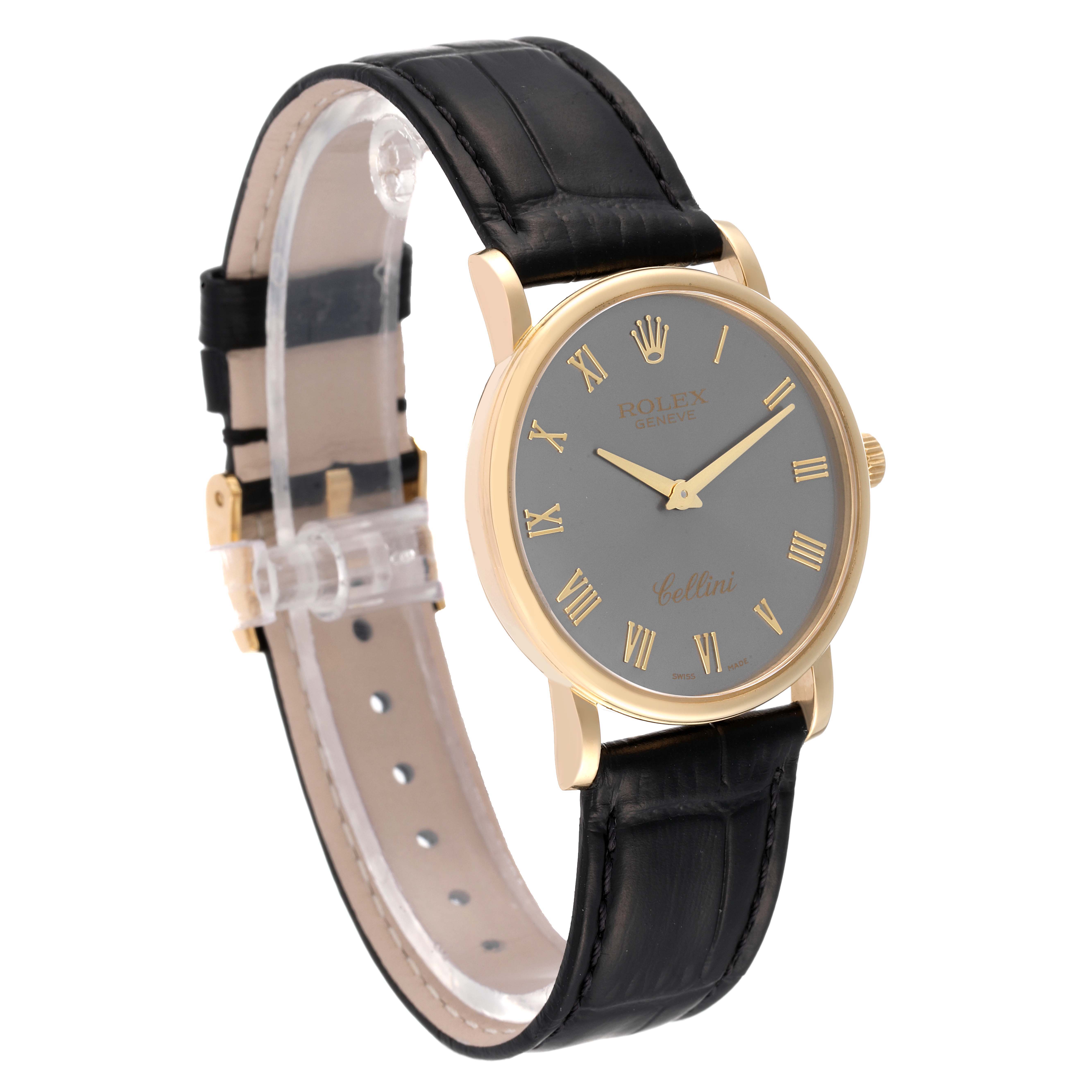 The image shows a side-angle view of a Rolex Cellini 5115 Men's Yellow Gold Grey Dial 5115 Men's Yellow Gold Grey Dial watch, highlighting the watch face, black leather strap, and gold casing.
