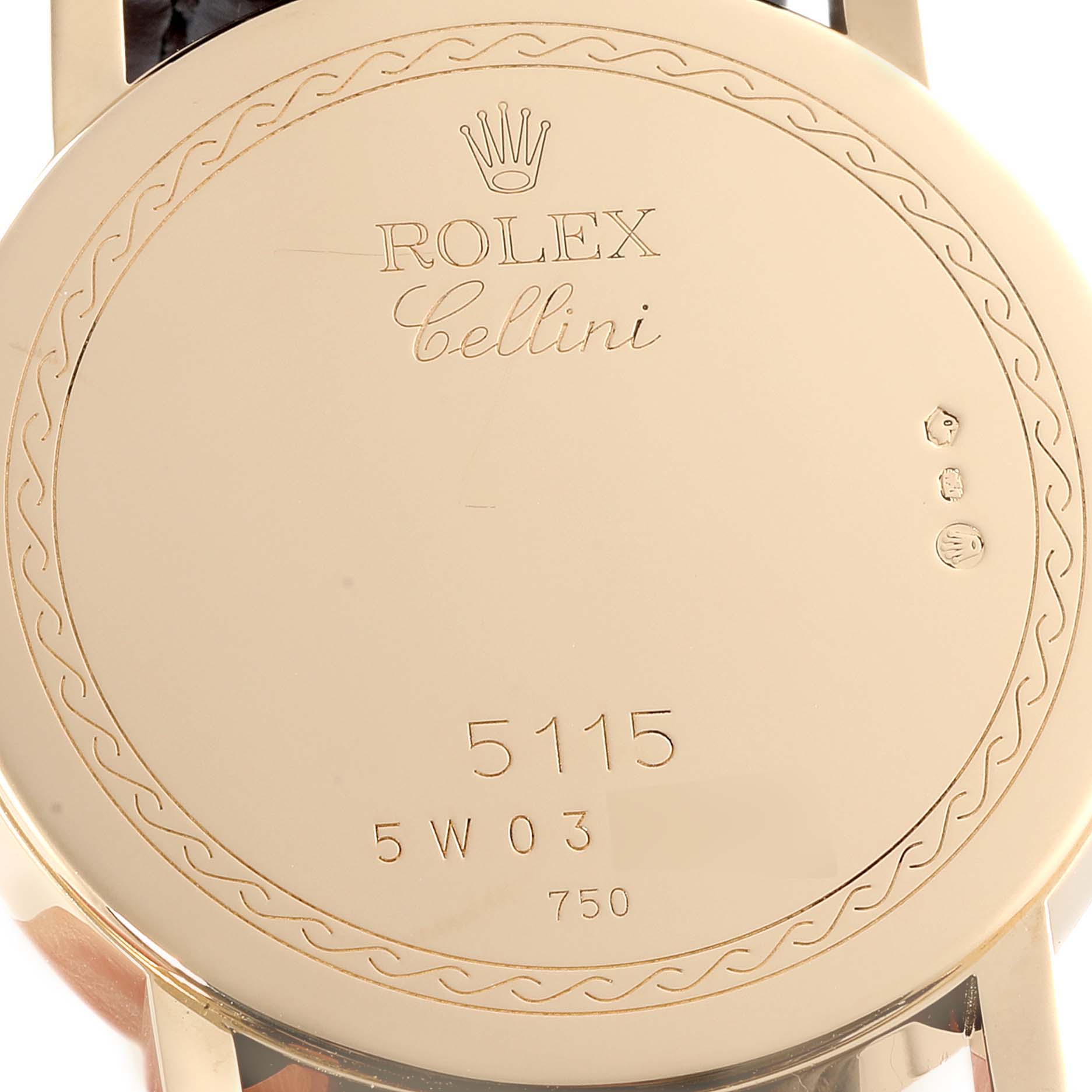 The image shows the case back of a Rolex Cellini 5115 Men's Yellow Gold Grey Dial 5115 Men's Yellow Gold Grey Dial model watch, displaying its serial number and branding.