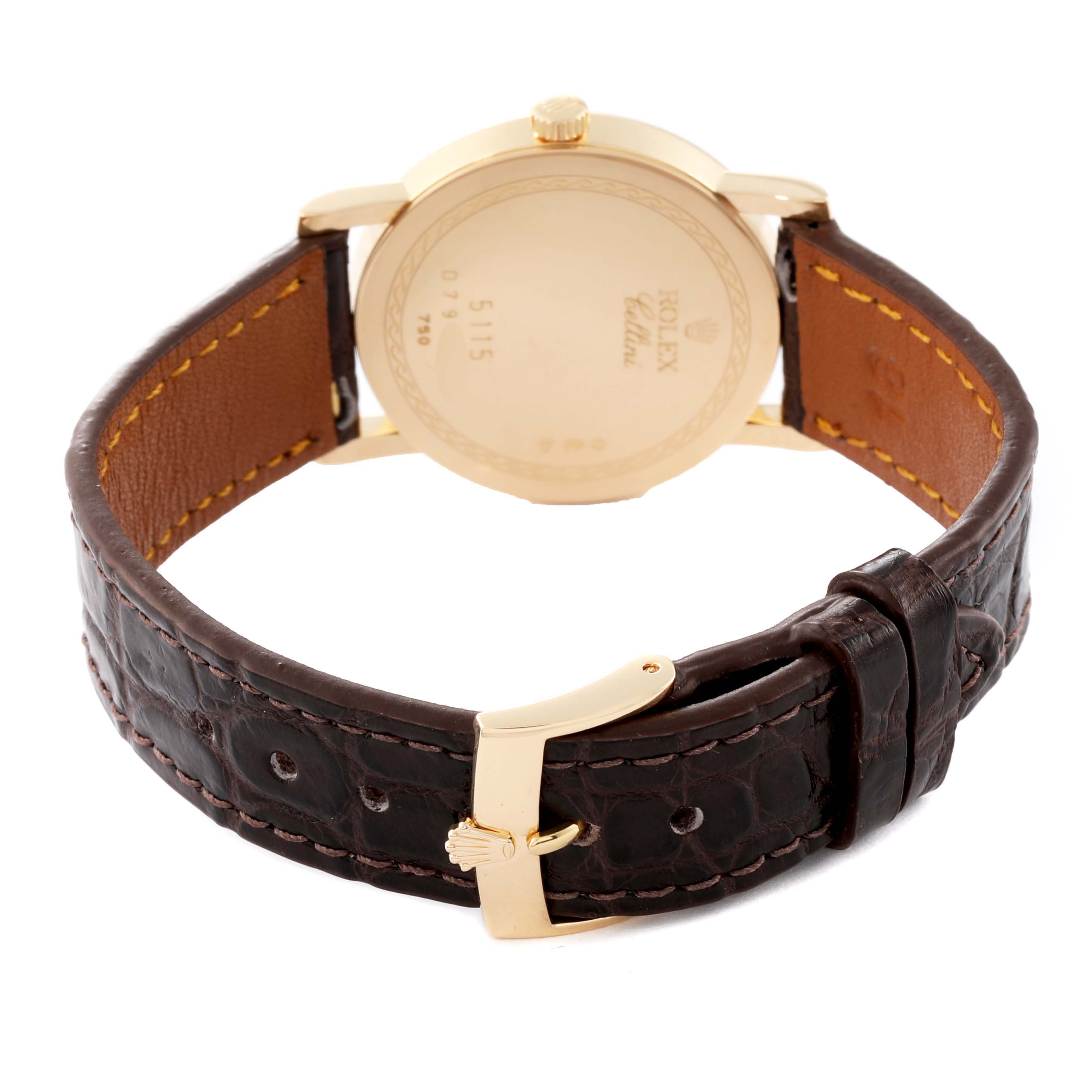 The image shows the back case and brown leather strap of a Rolex Cellini 5115 Men's Yellow Gold Champagne Dial 5115 Men's Yellow Gold Champagne Dial watch, including the gold clasp and buckle.