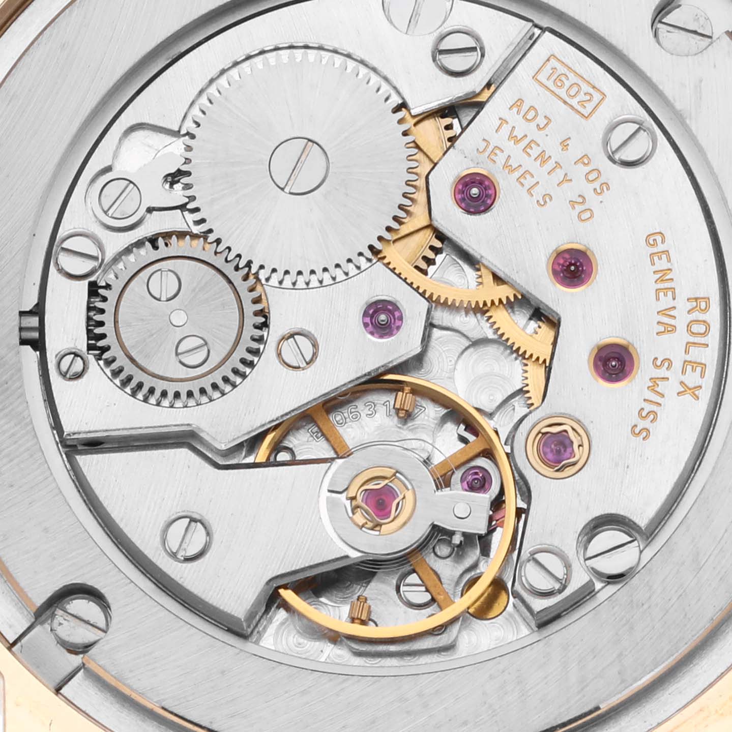 The image shows a close-up of the movement mechanism inside a Rolex Cellini 5115 Men's Yellow Gold Mother of Pearl Dial 5115 Men's Yellow Gold Mother of Pearl Dial watch, highlighting gears and jewels.