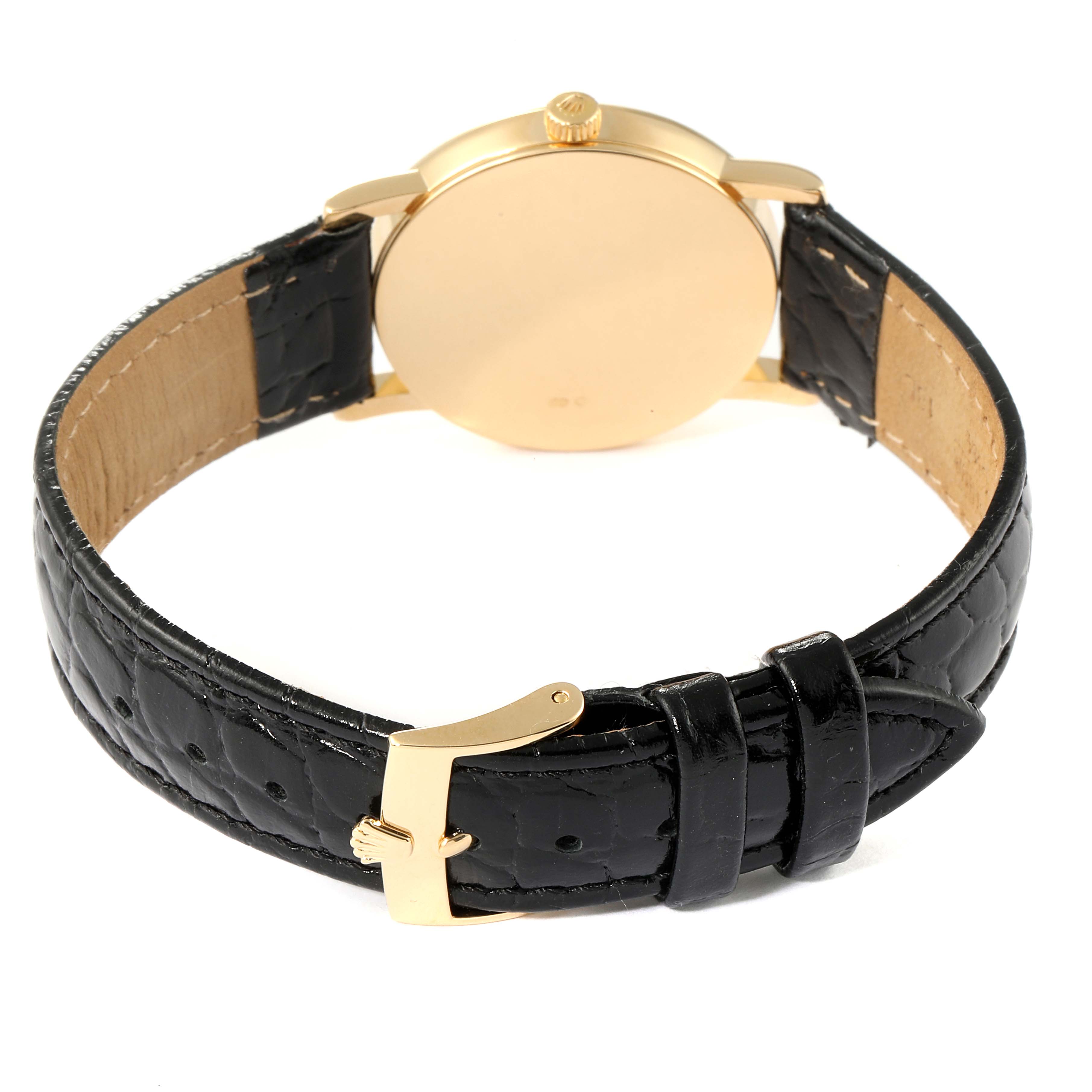 The image shows the back view of the Rolex Cellini 5115 Men's Yellow Gold Silver Dial 5115 Men's Yellow Gold Silver Dial watch, highlighting its gold case and black leather strap with a buckle.