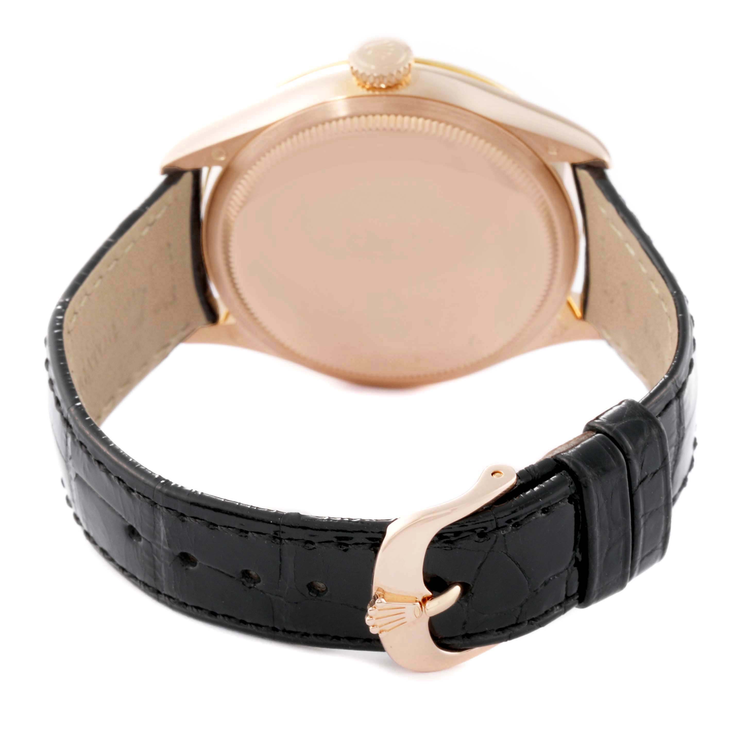 This image shows the back view of a Rolex Cellini 50705 Men's Rose Gold Pink Dial 50705 Men's Rose Gold Pink Dial watch, highlighting its case back, crown, and closed leather strap with a buckle.