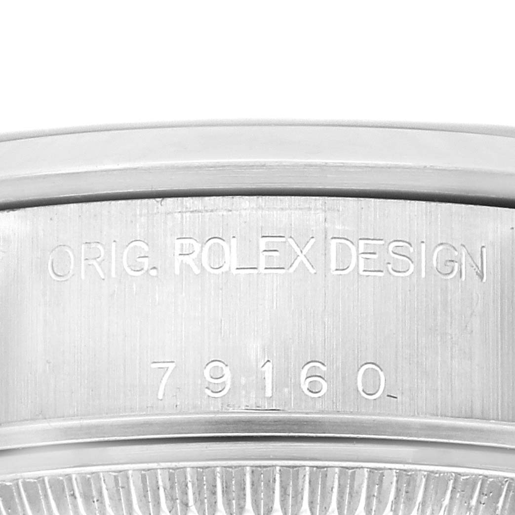 The image shows a close-up of the side of the Rolex Date 79160 Women's Stainless Steel Pink Dial 79160 Women's Stainless Steel Pink Dial model, displaying the engravings "ORIG. ROLEX DESIGN 79160."