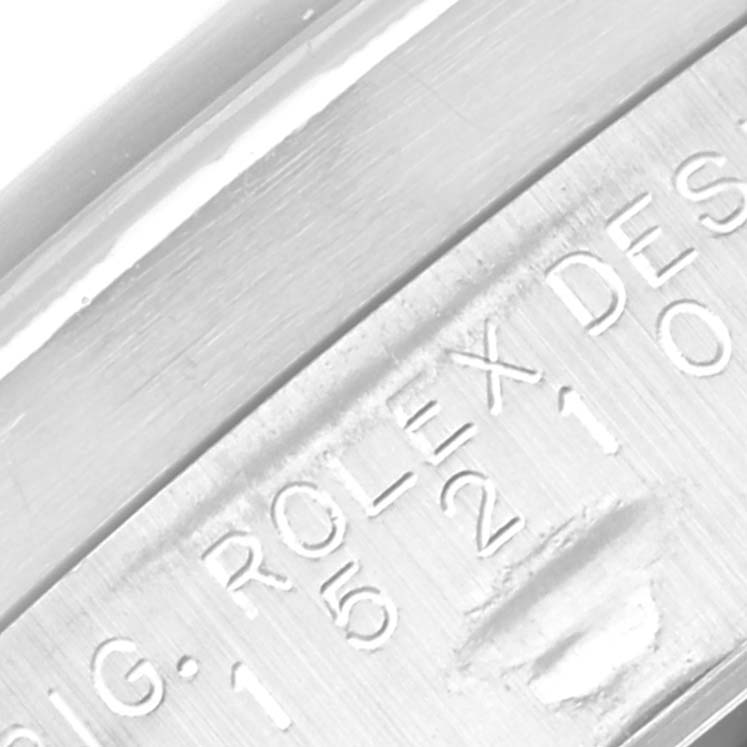 This image shows a close-up of the Rolex Date 15210 Men
s Stainless Steel Black Dial 15210 Men
s Stainless Steel Black Dial watch case with engraved markings.