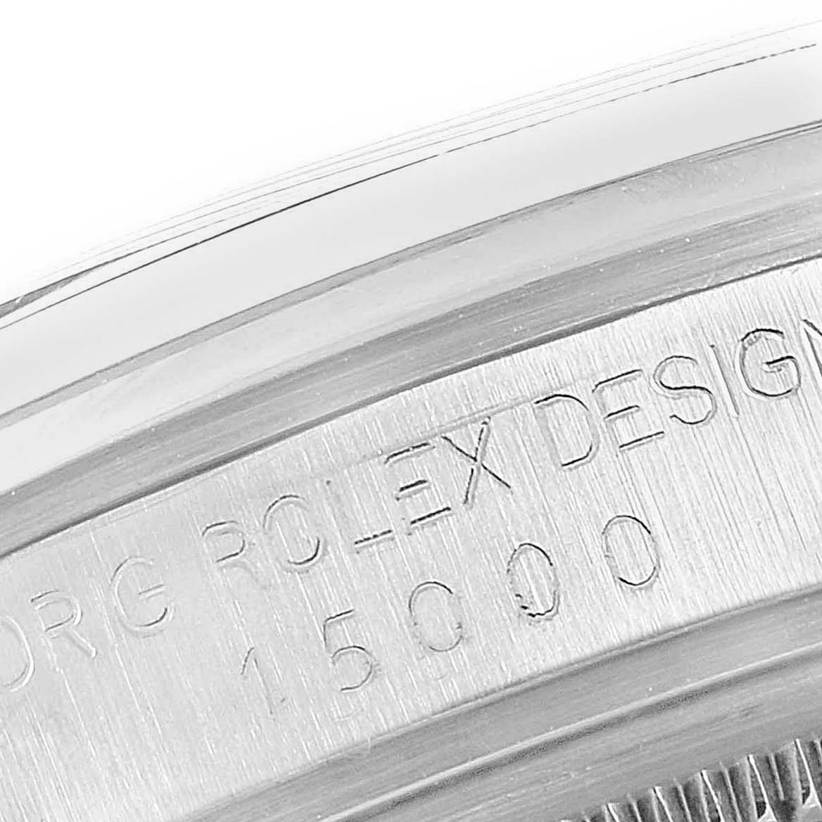 This image shows a close-up angle of the engraved rim on a Vintage Collection Rolex watch.