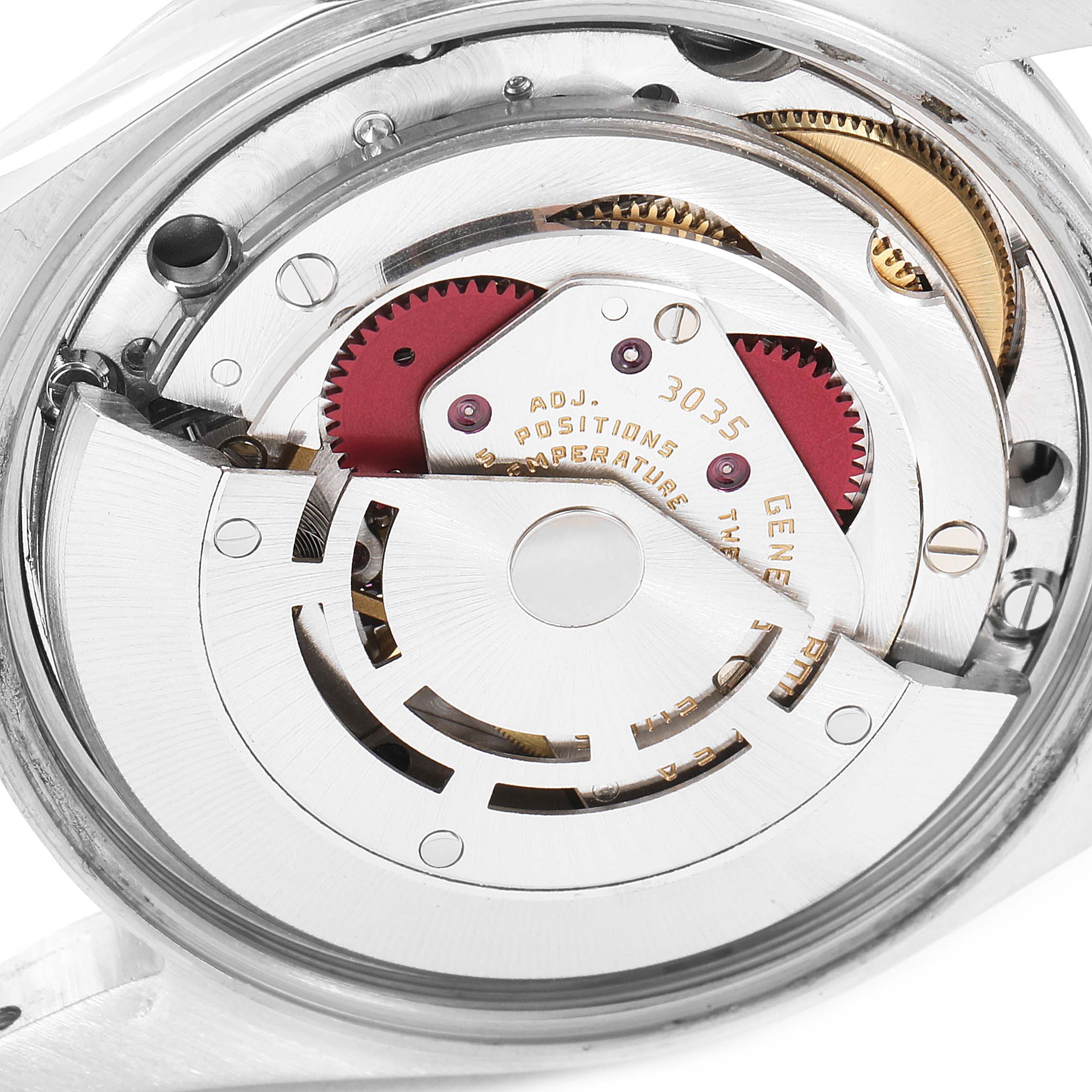 The image shows the internal mechanism of a Vintage Collection Rolex watch from a rear angle.