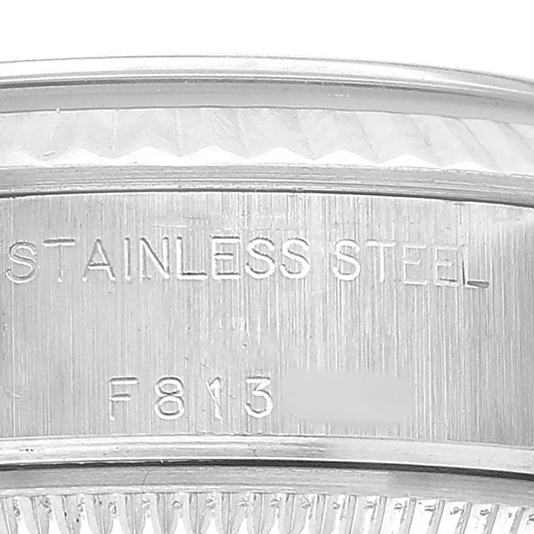 The image shows a close-up of the Rolex Datejust 79174 Women's Stainless Steel Silver Dial case edge with "STAINLESS STEEL" engraved.