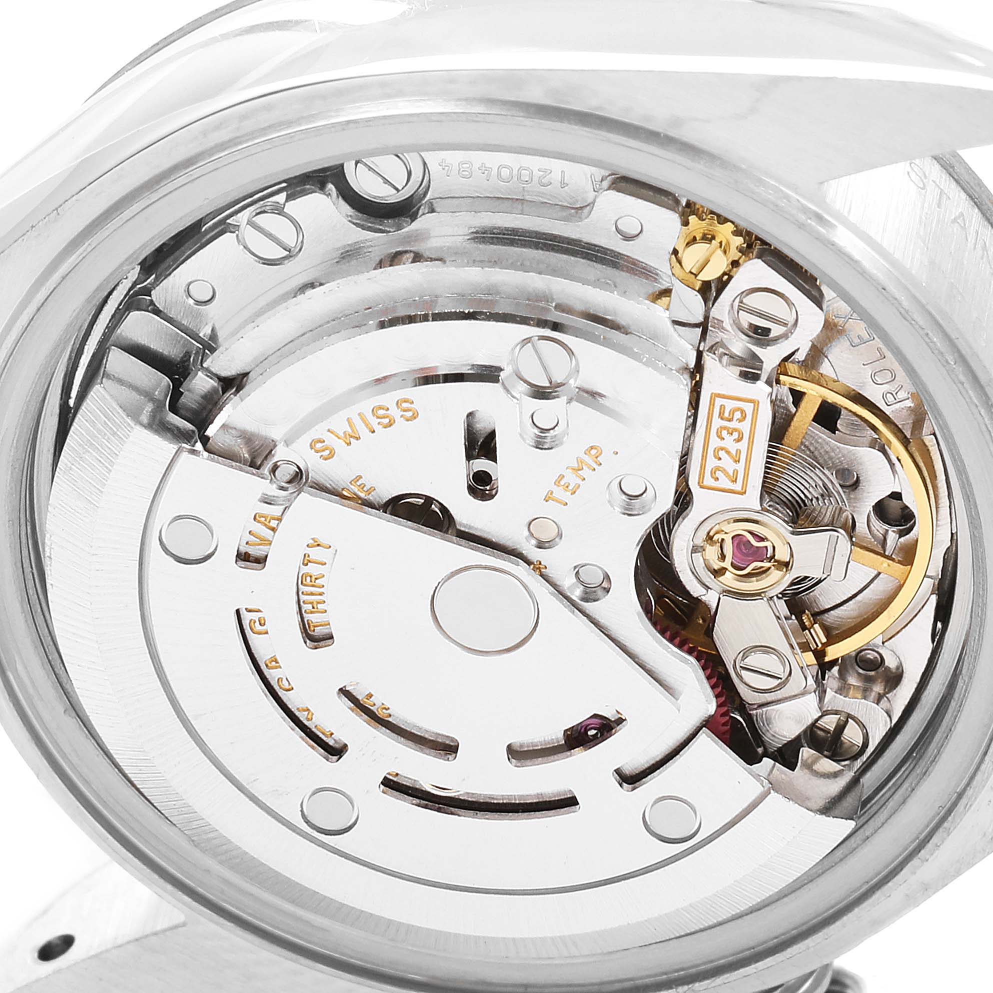 The image shows a close-up view of the movement mechanism inside a Rolex Datejust 79174 Women
s Stainless Steel White Dial 79174 Women
s Stainless Steel White Dial watch.